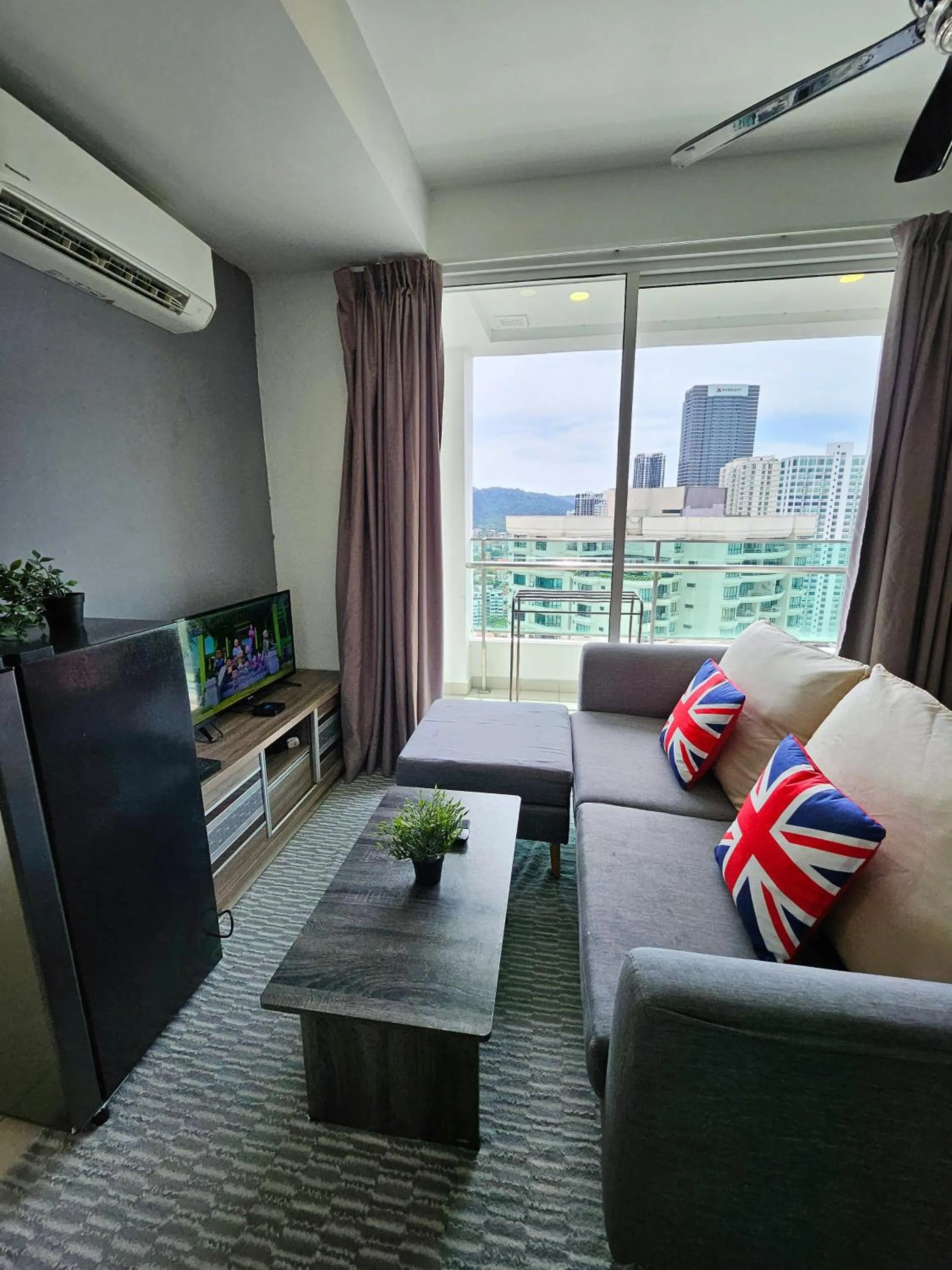 Living room in Mansion One by Sky Hive