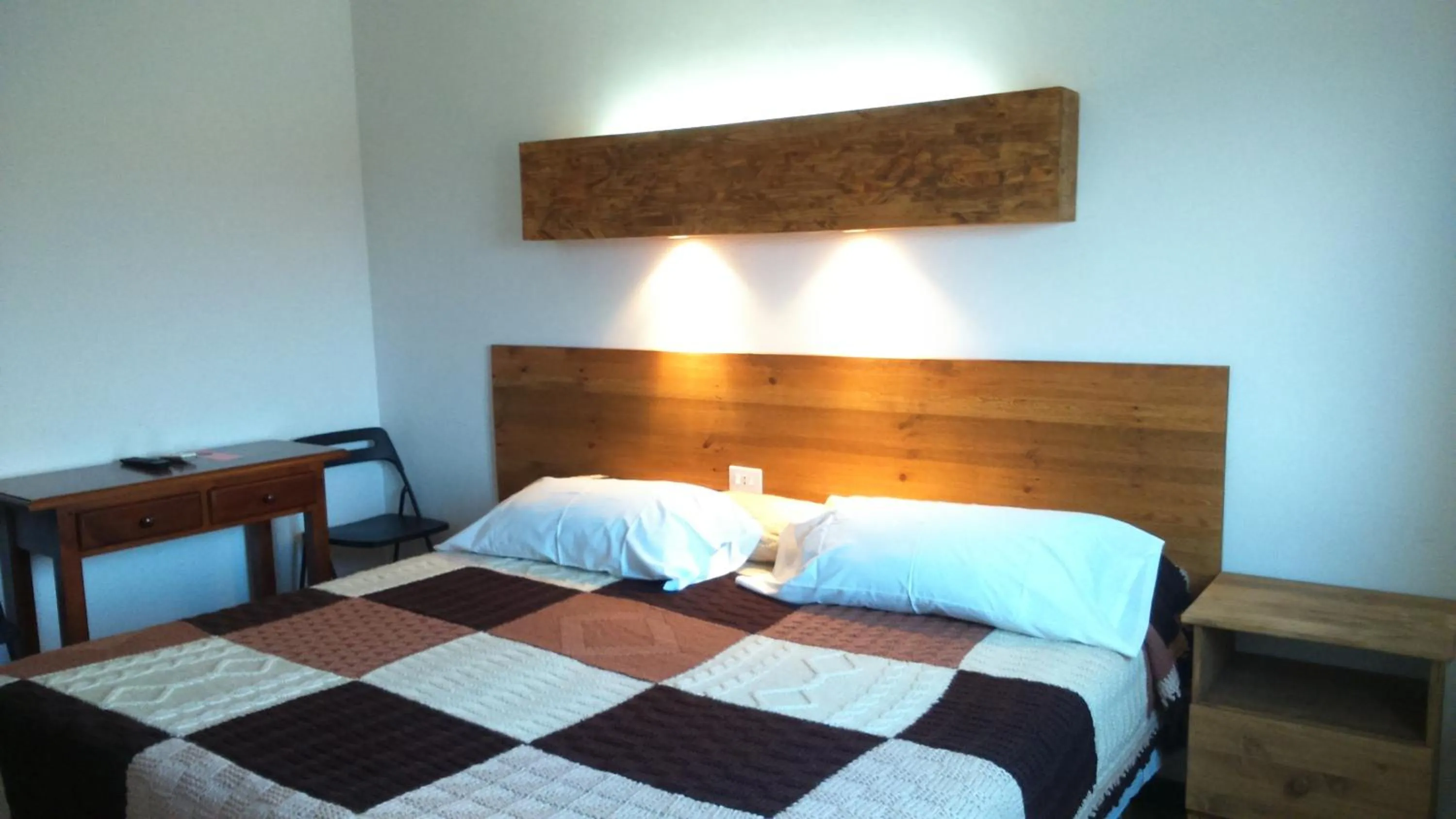 Photo of the whole room, Bed in La Masia