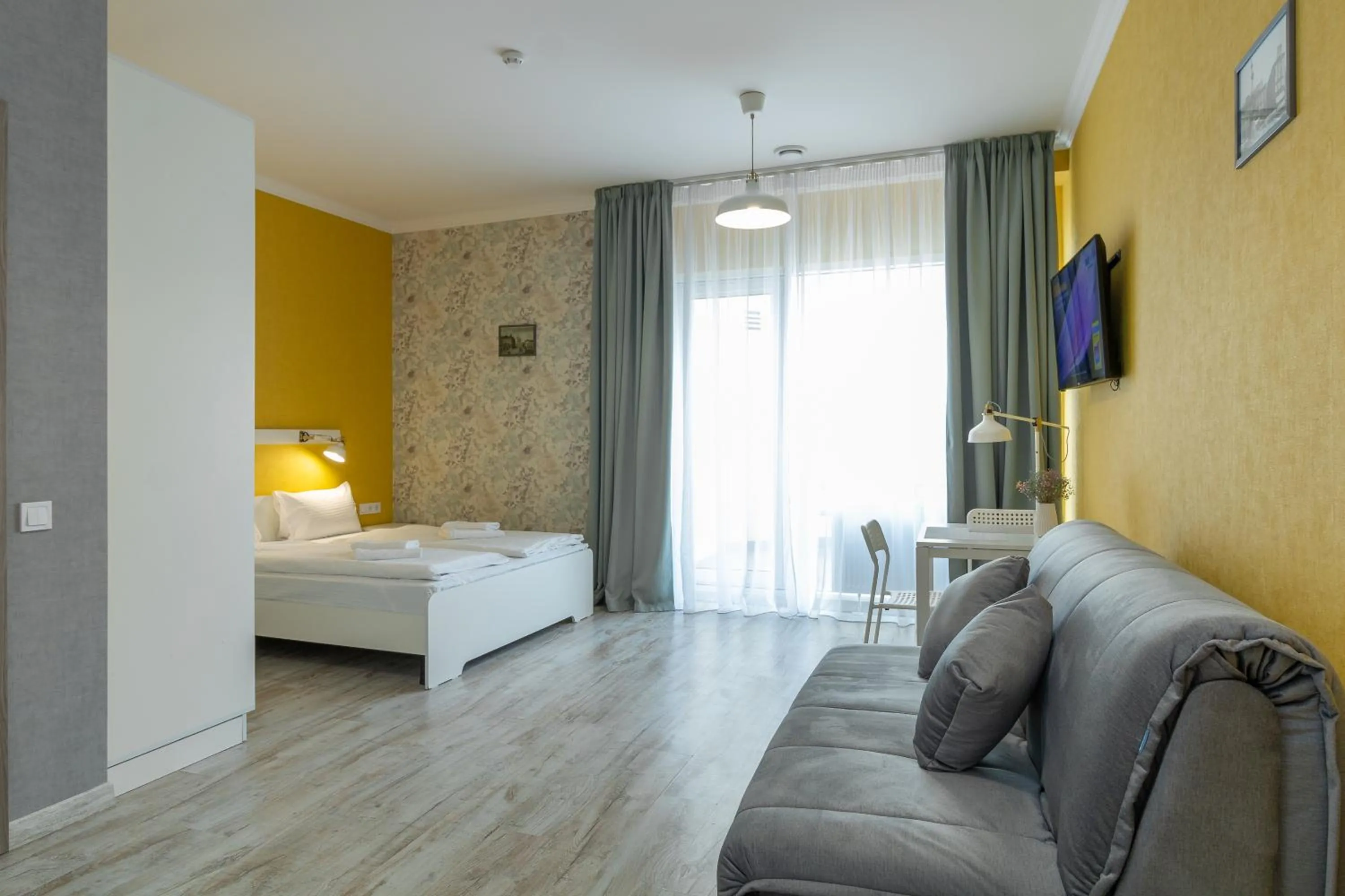 Communal lounge/ TV room, Bed in Opera Passage Hotel & Apartments