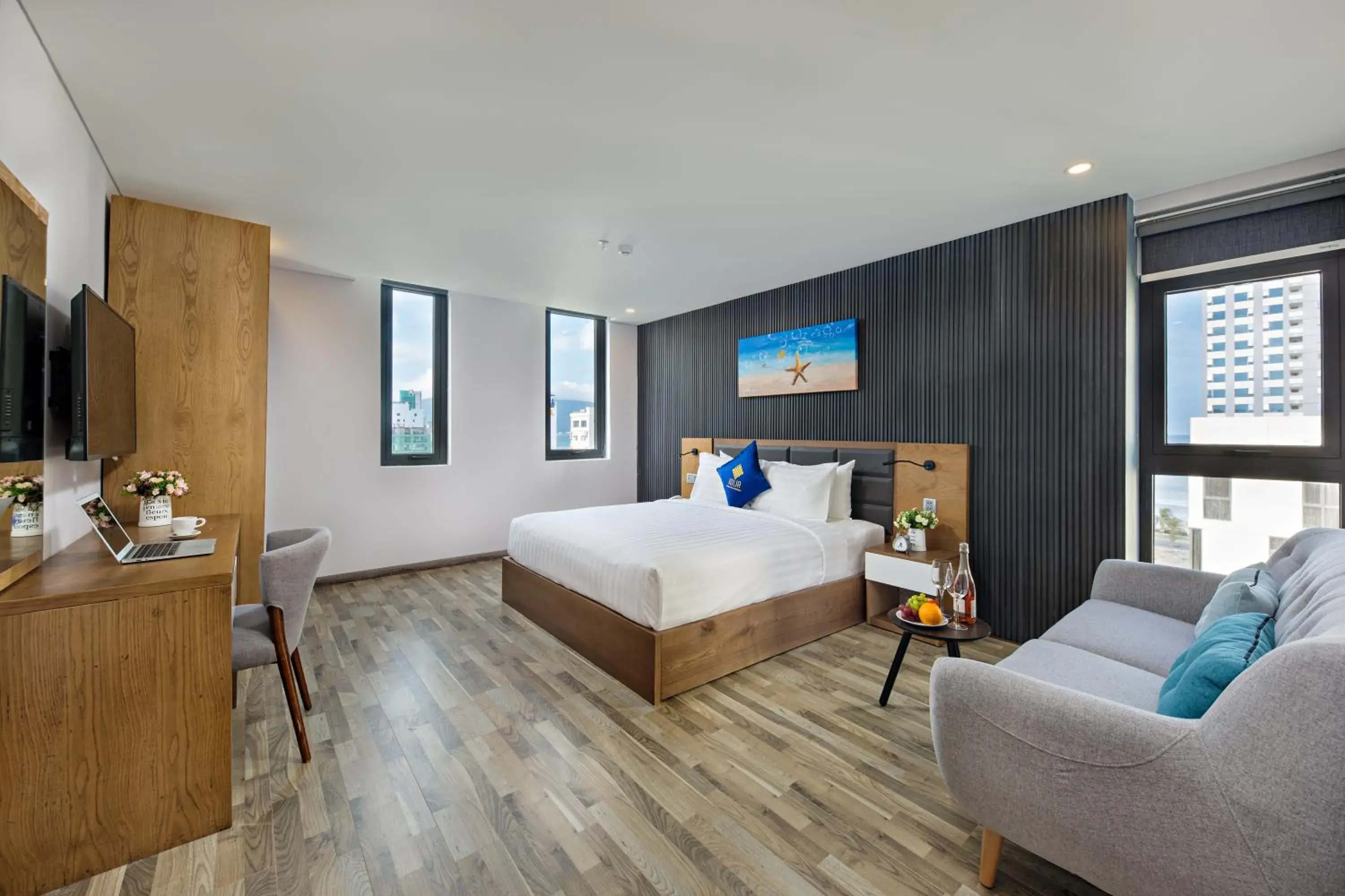 Communal lounge/ TV room, Bed in Jolia Hotel Danang Beach Communal lounge/ TV room, Bed in Jolia Hotel Danang Beach