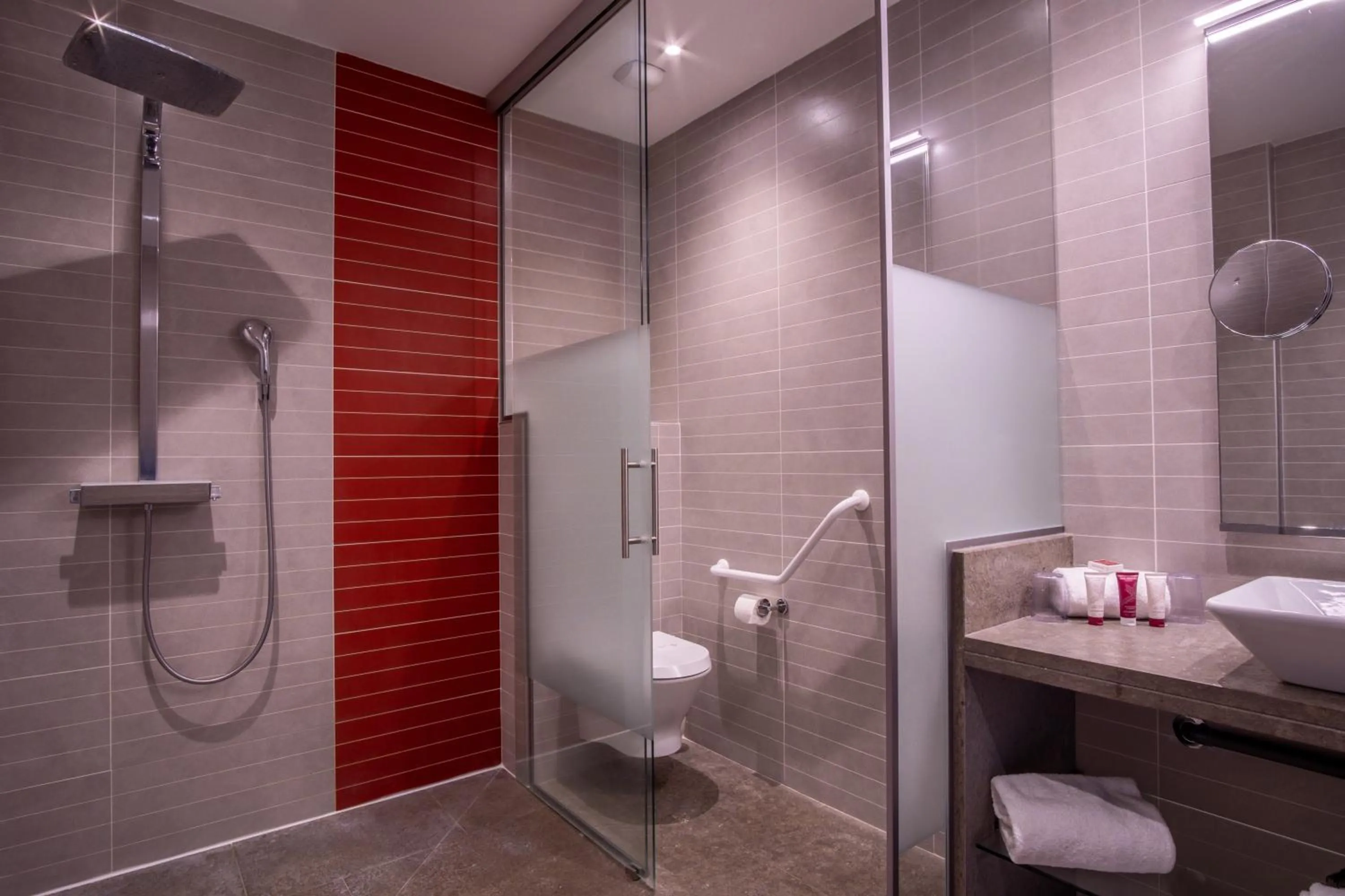 Shower in Kyriad Prestige Lyon Est - Saint Priest Eurexpo Hotel and SPA