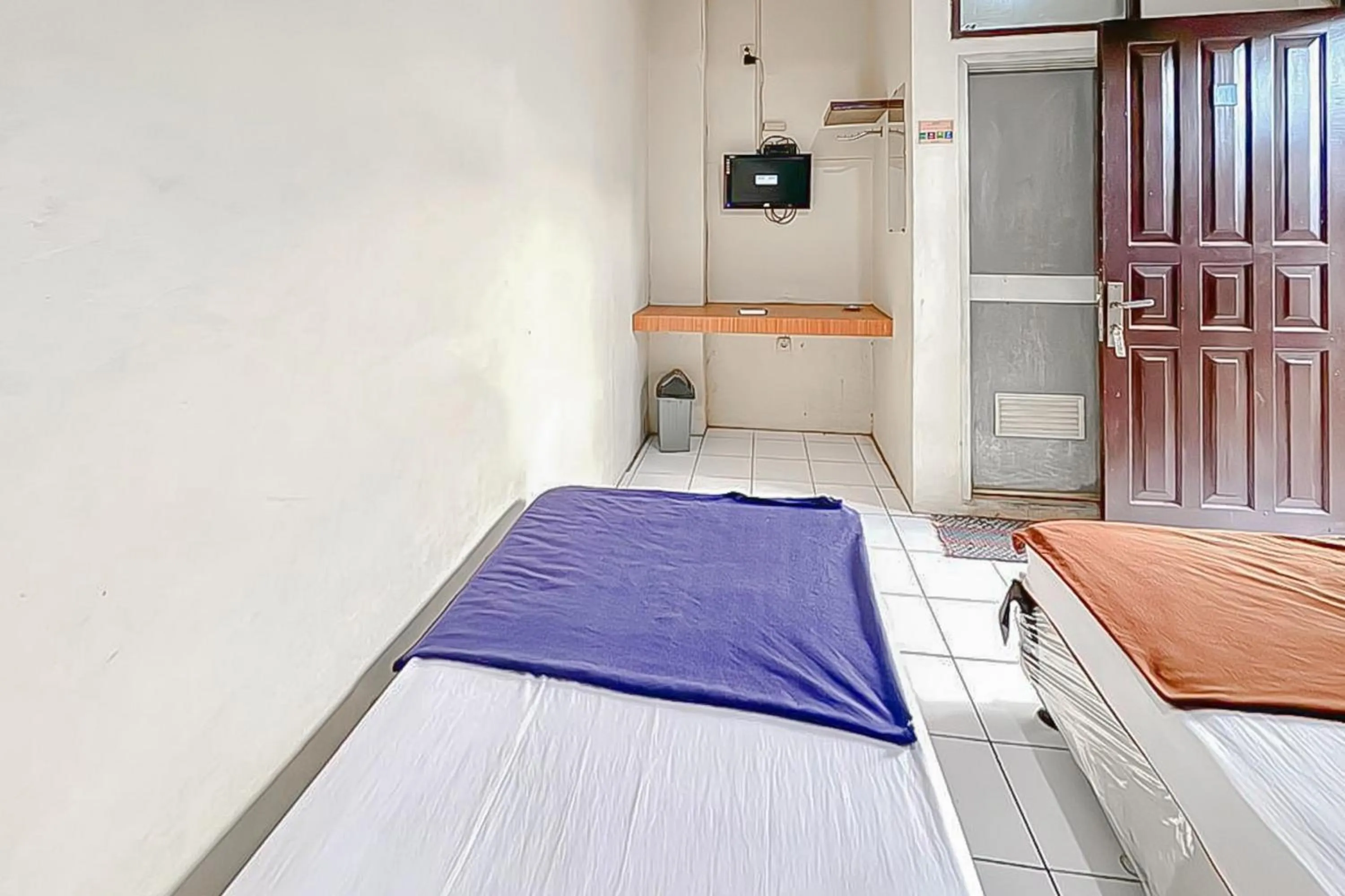 Bedroom, Bed in Fajar Indah Hotel Mitra RedDoorz