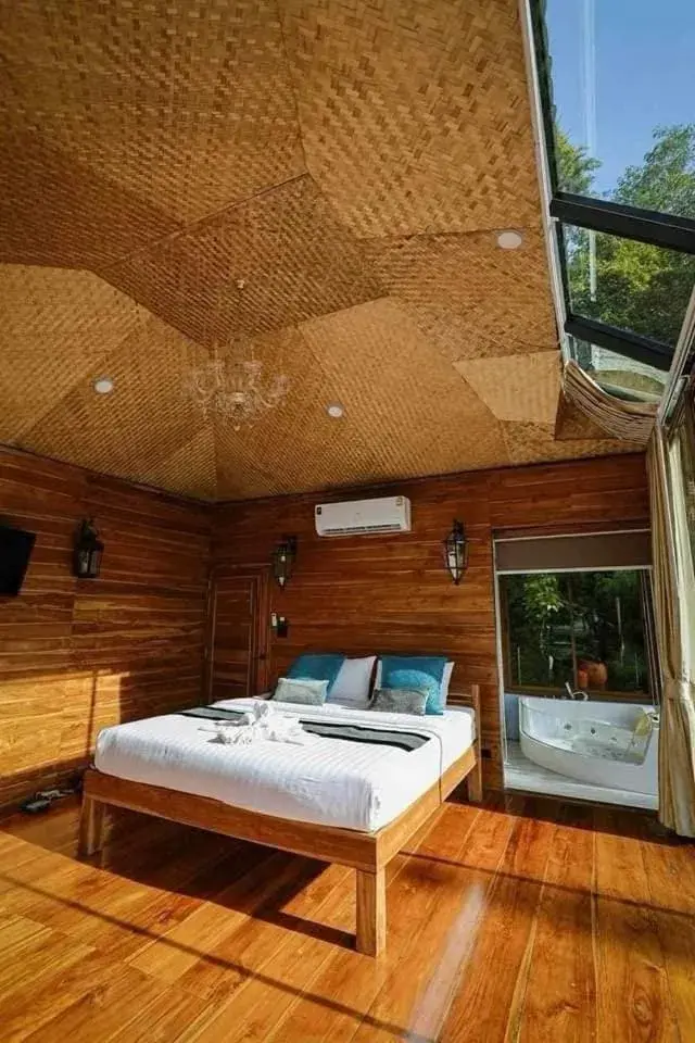 Bed in Kodaun River Kwai Resort Bed in Kodaun River Kwai Resort