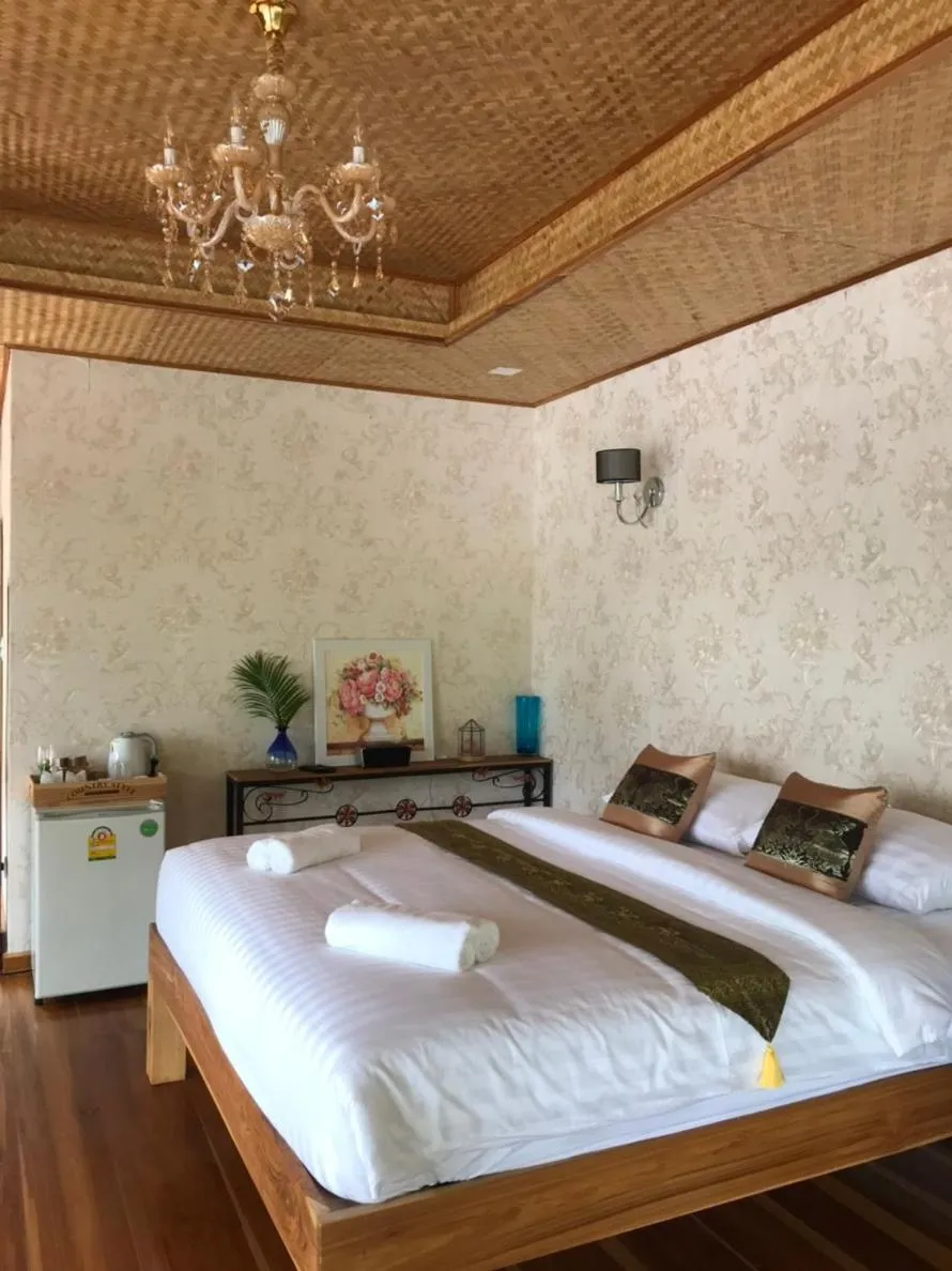 Bed in Kodaun River Kwai Resort