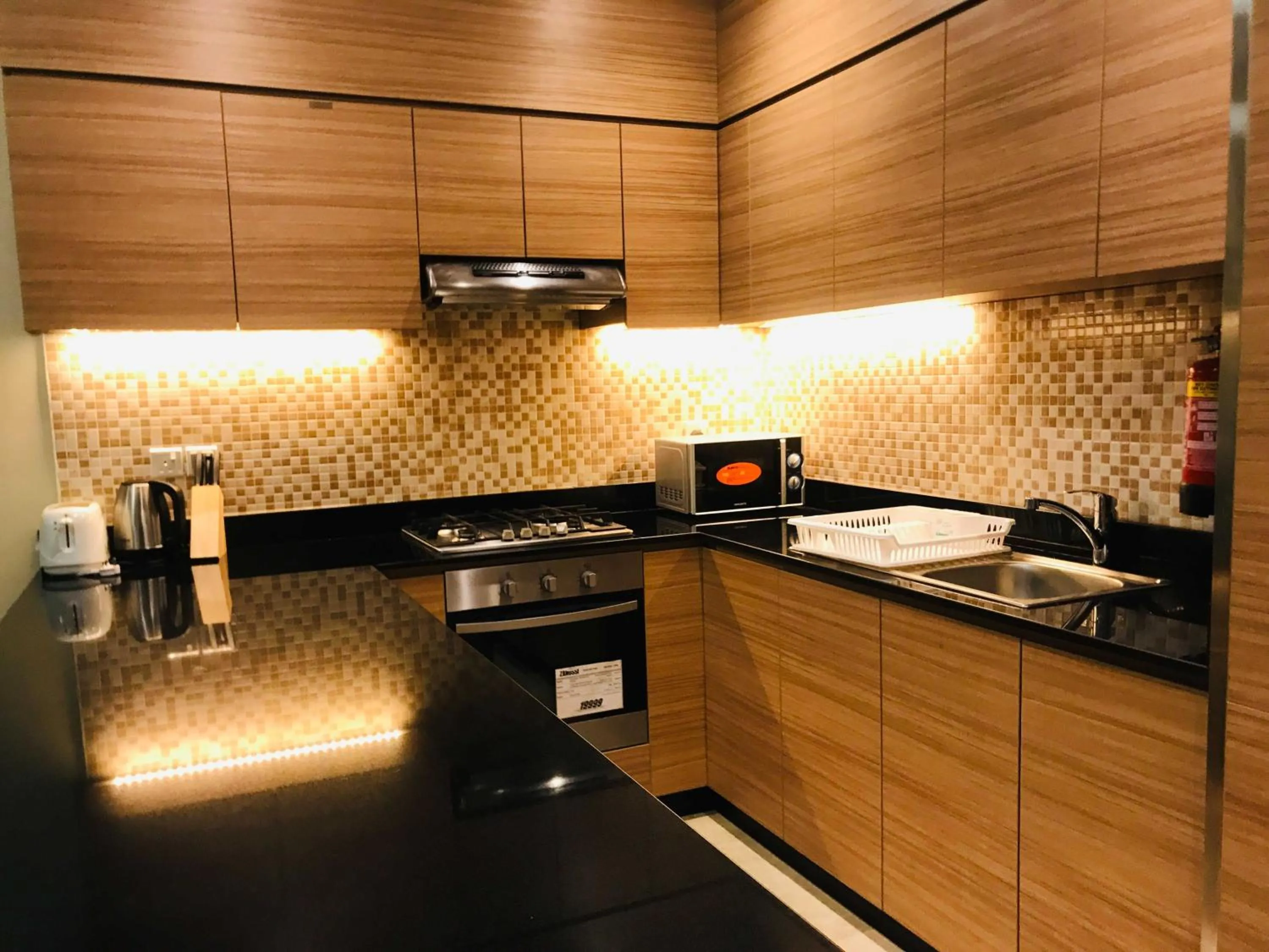 Kitchen or kitchenette in Tulip Al Barsha Hotel Apartment