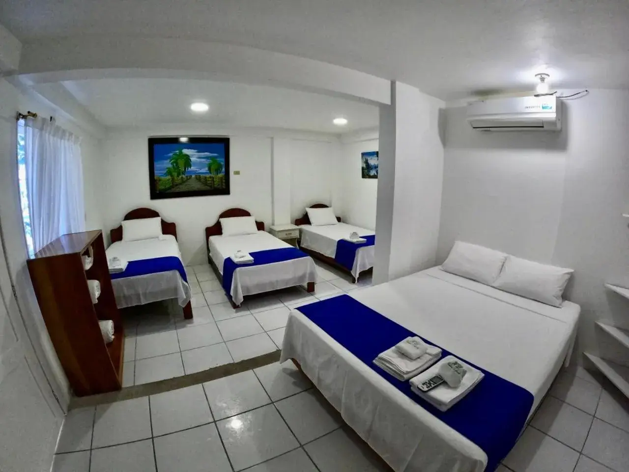 group of guests, Bed in Galápagos Isabela Hotel Loja group of guests, Bed in Galápagos Isabela Hotel Loja