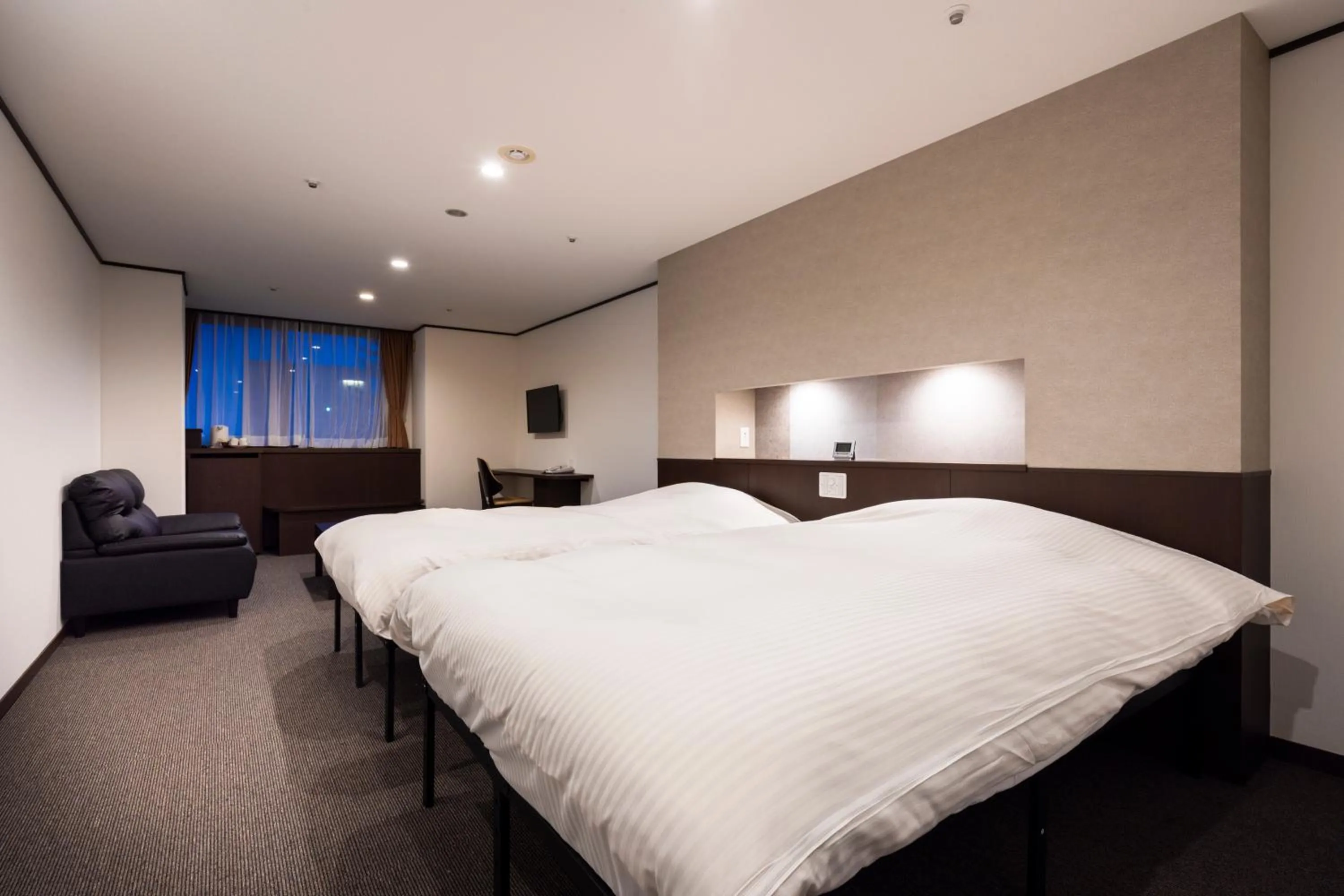 Bed in Hotel Kanronomori