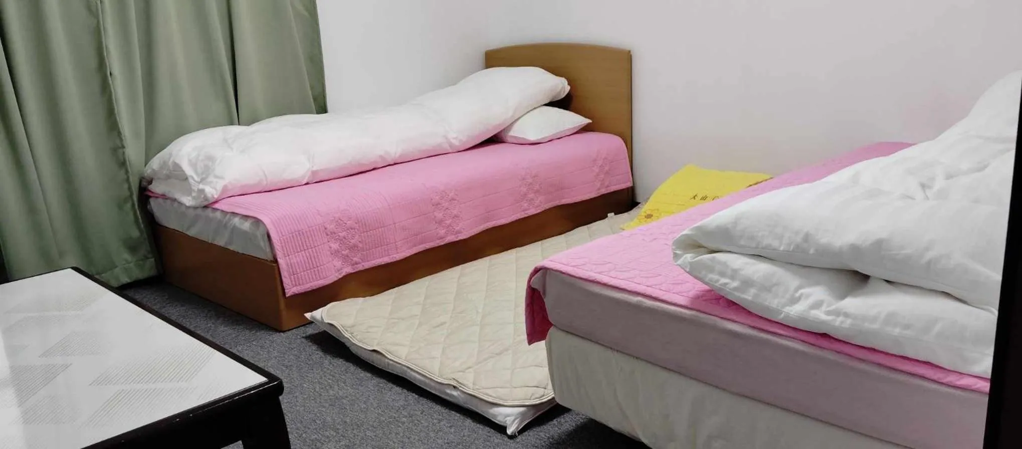 Bed in Oyama Guesthouse Kyoto