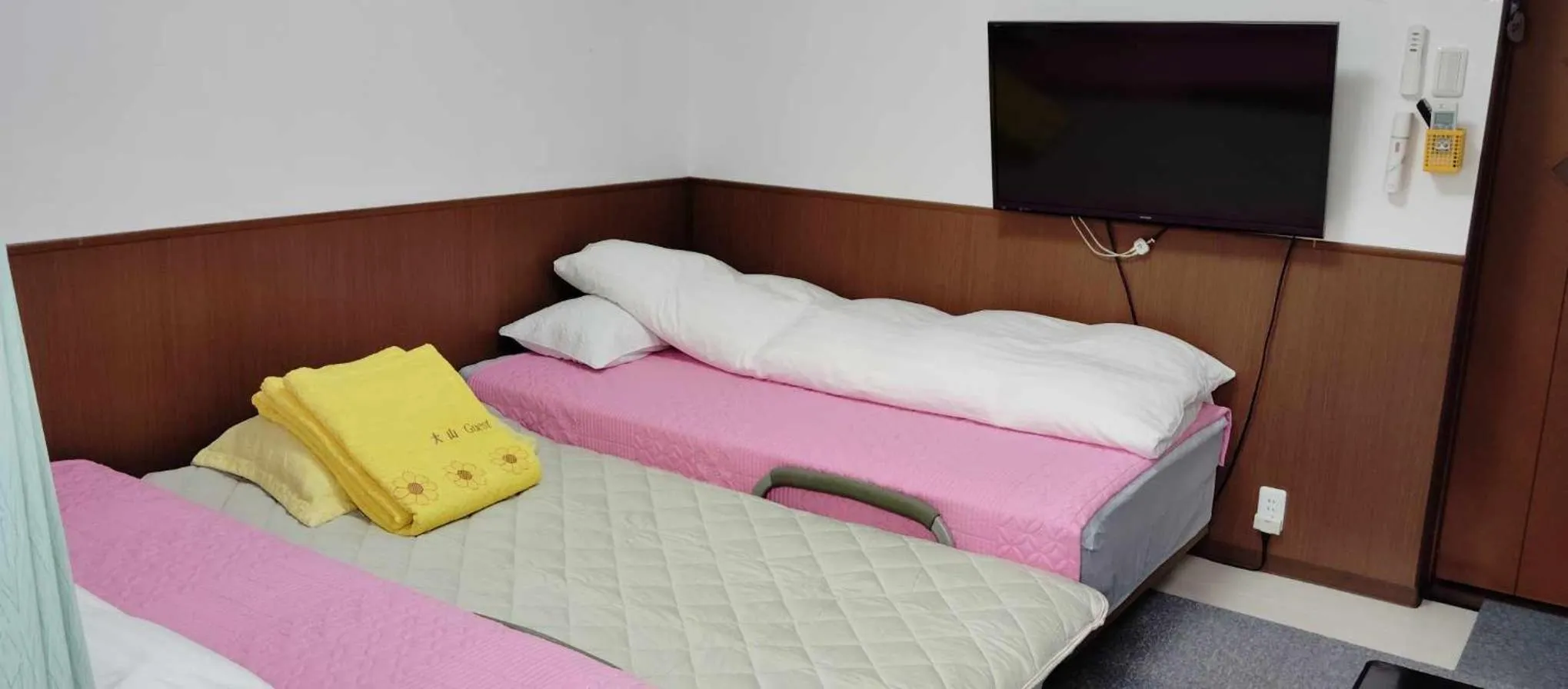 Bed in Oyama Guesthouse Kyoto