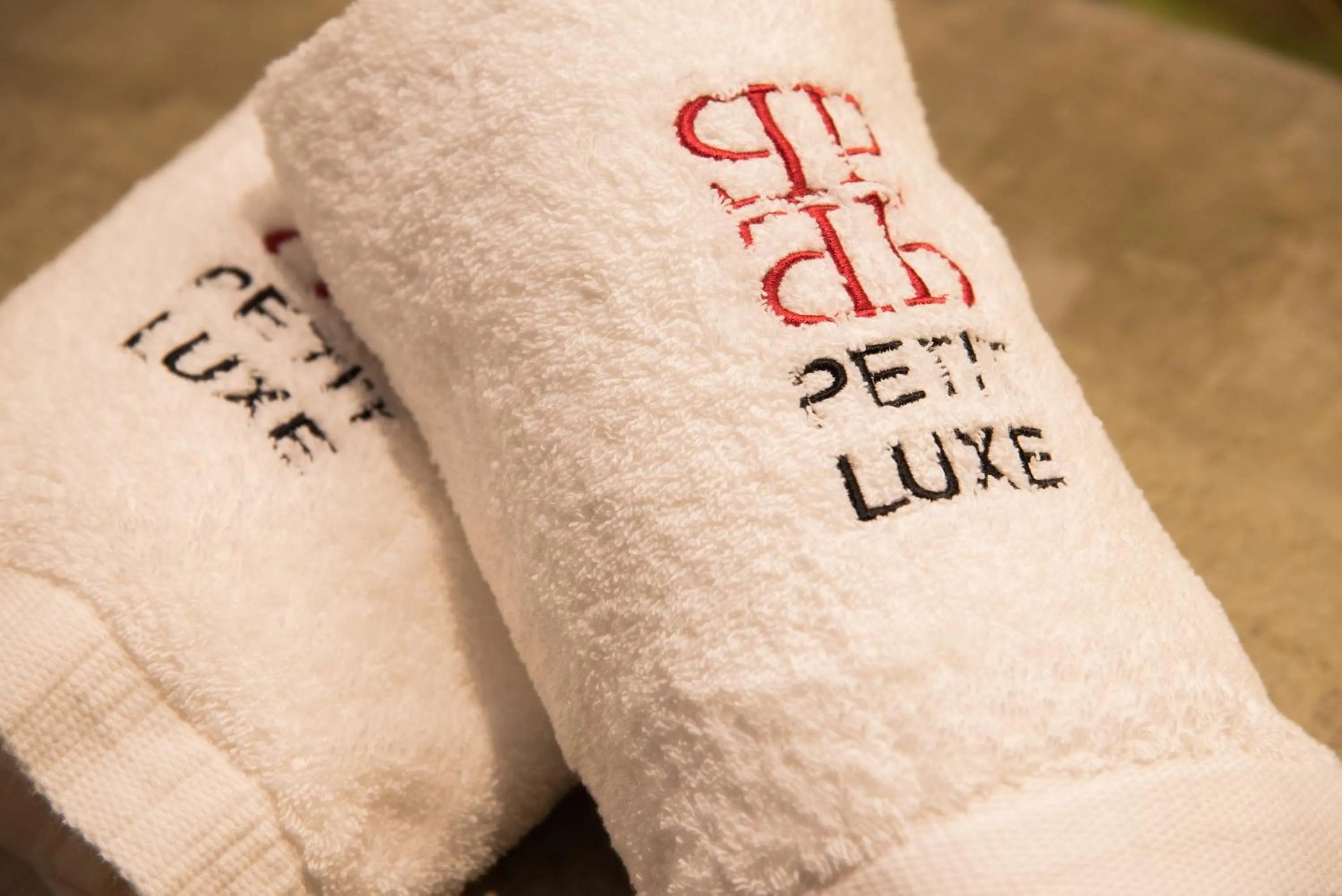 Property logo or sign in Petit Luxe Loft