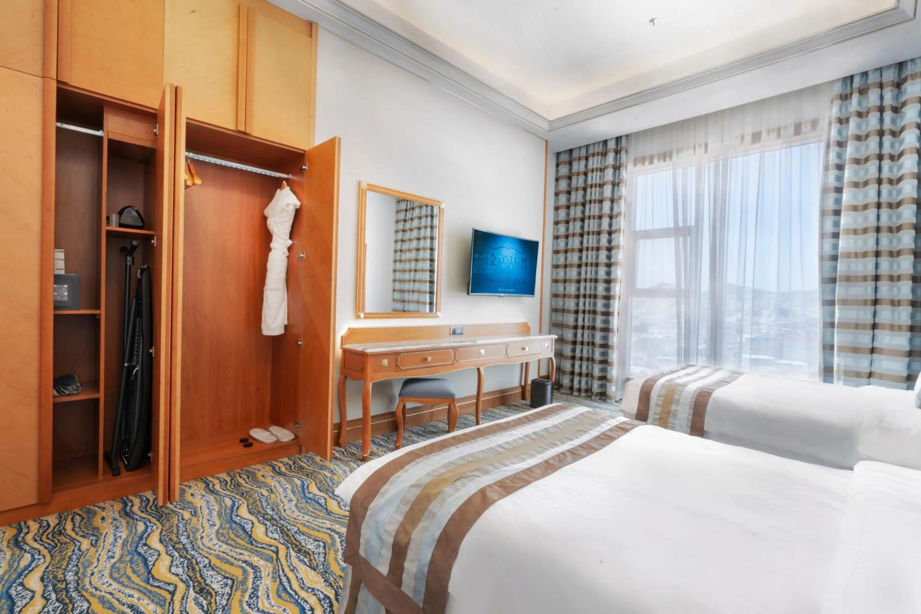 Bed in Iridium Hotel