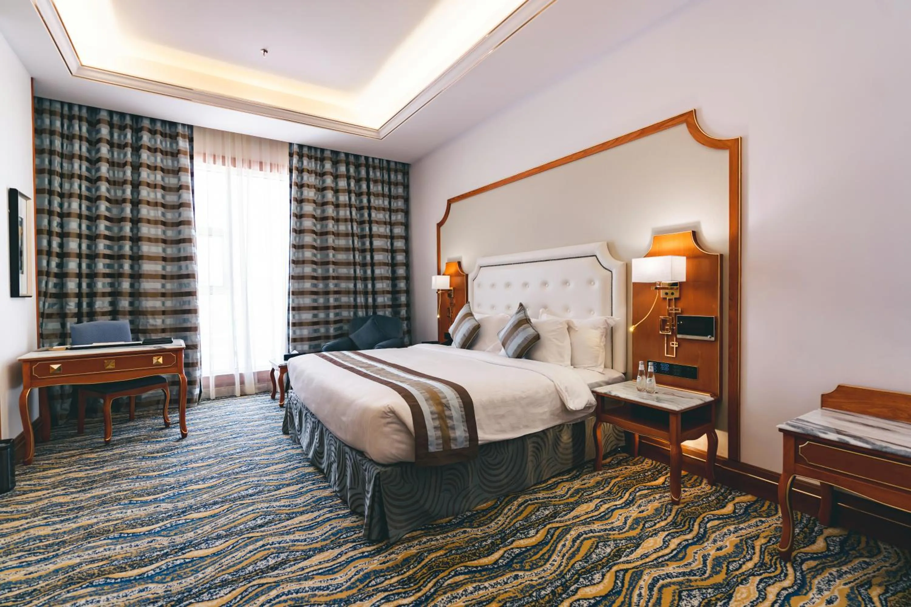 Bed in Iridium Hotel