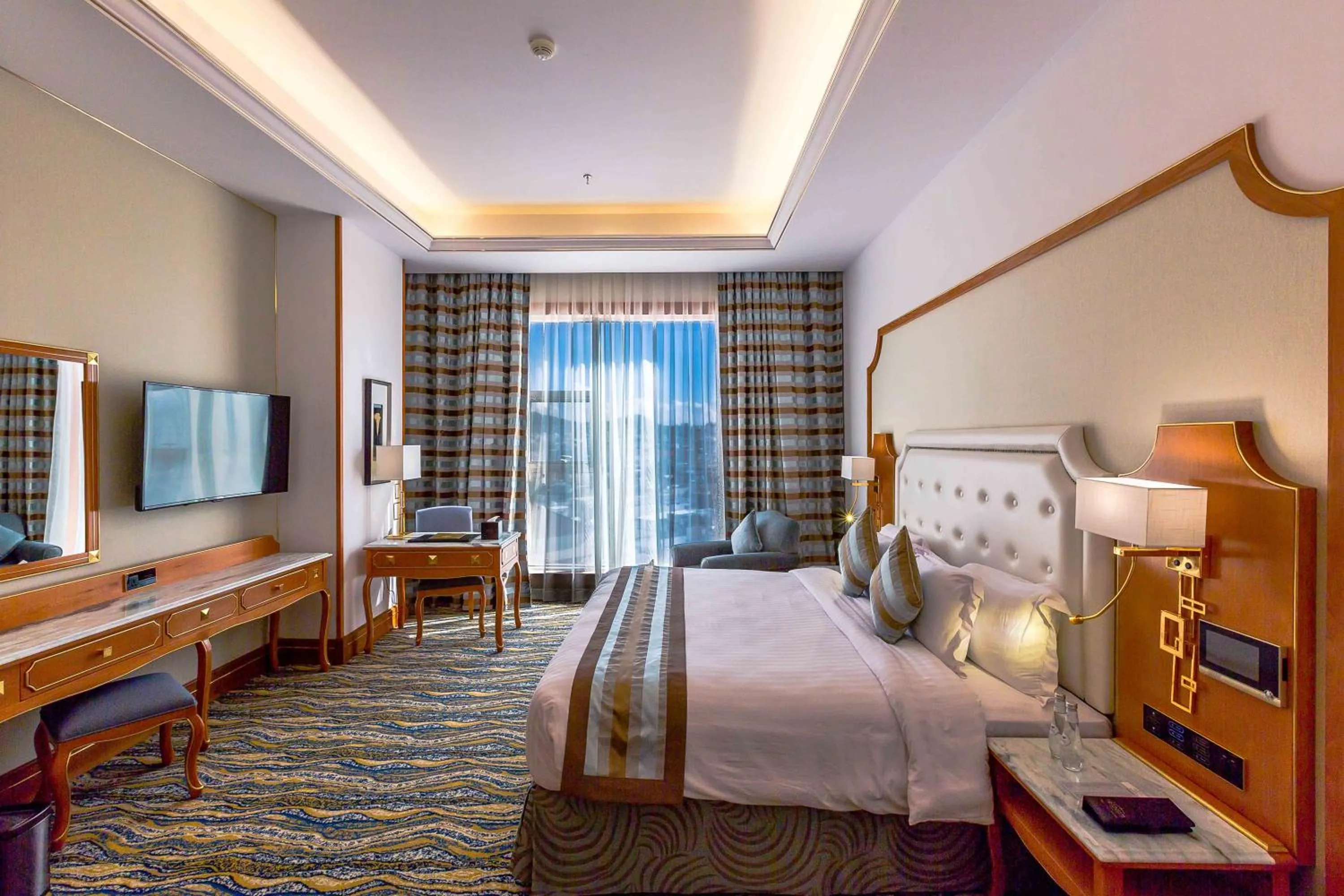 Bed in Iridium Hotel