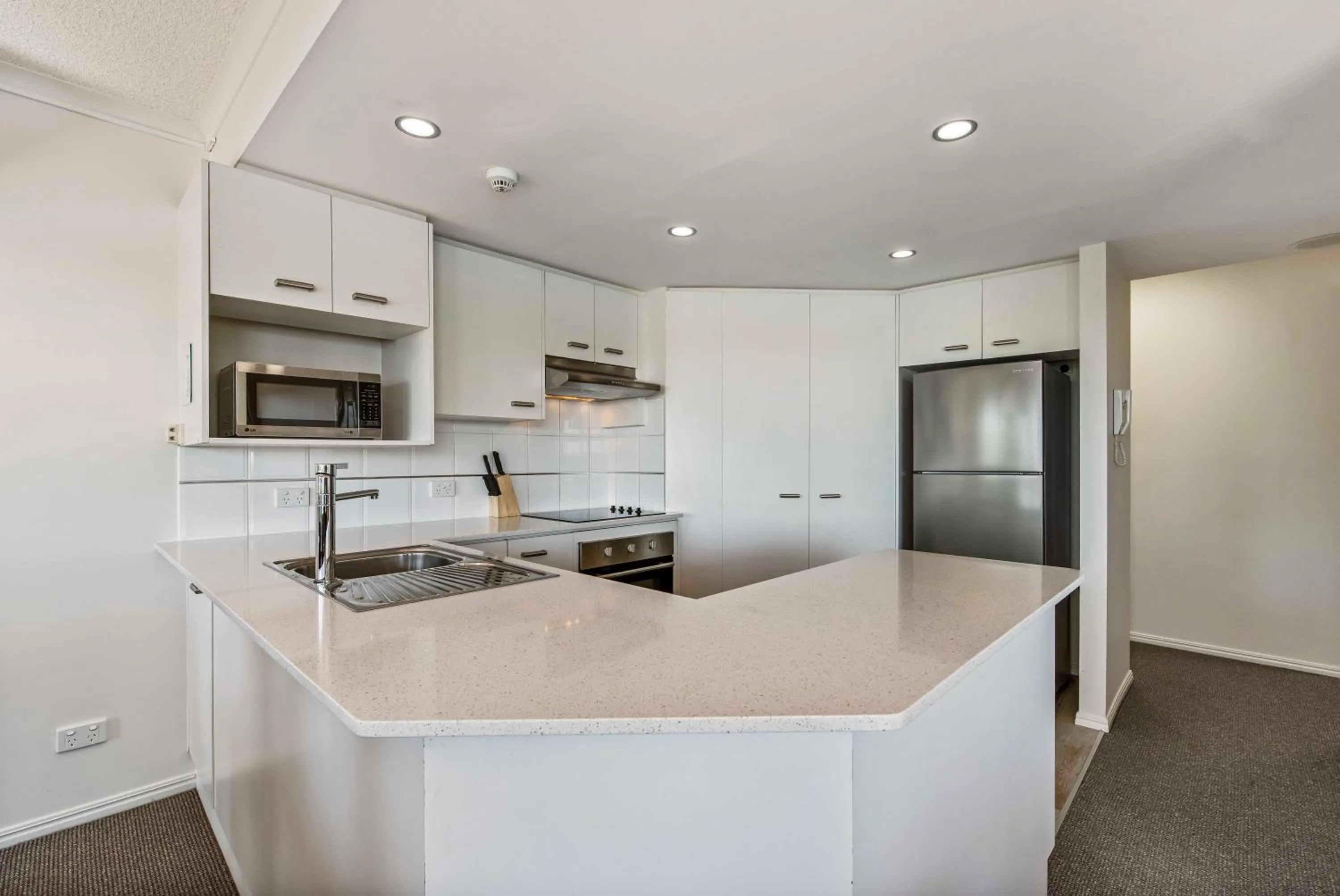 Kitchen or kitchenette in Reflections Holiday Apartments