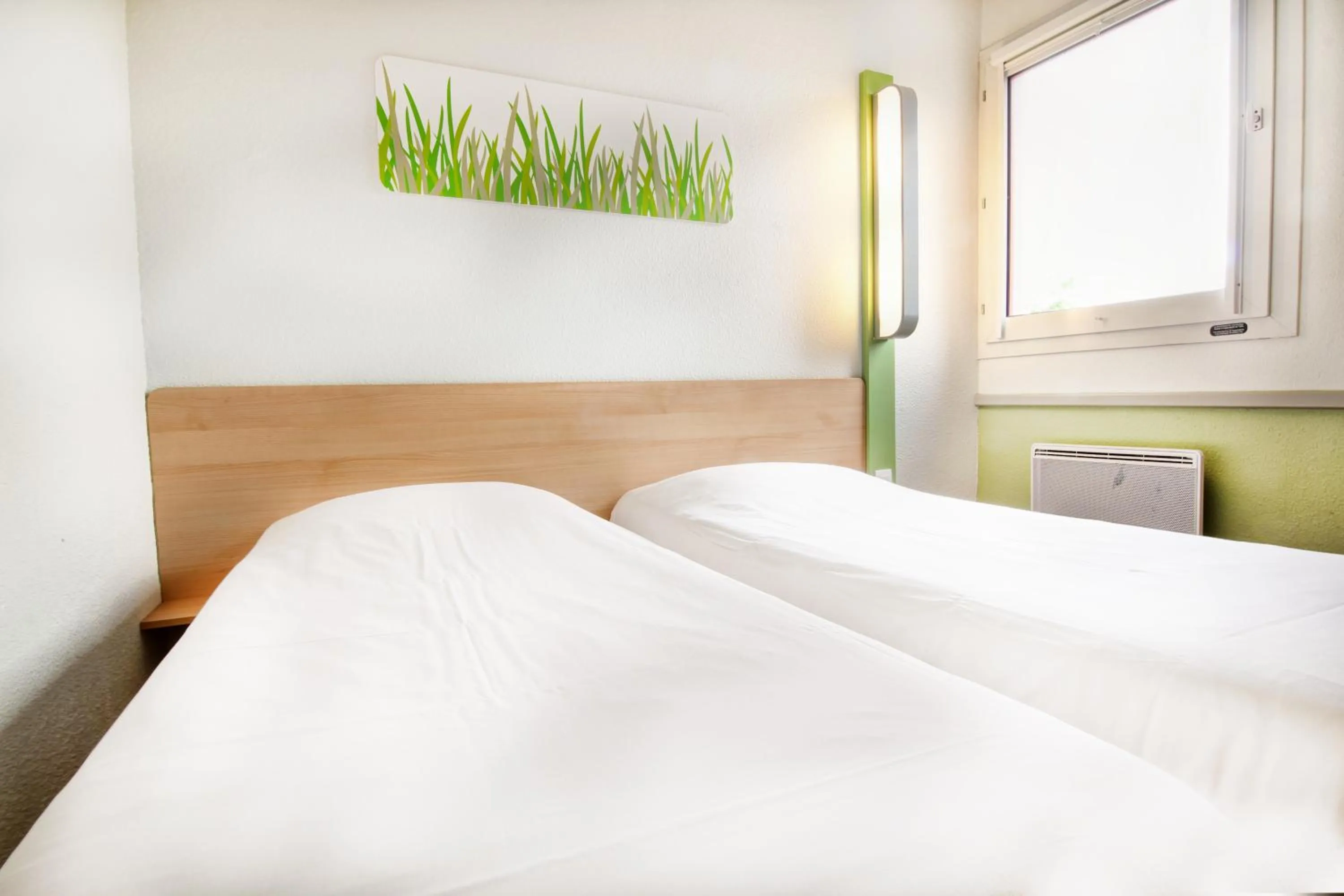 Bed in ibis budget Besançon Ecole Valentin