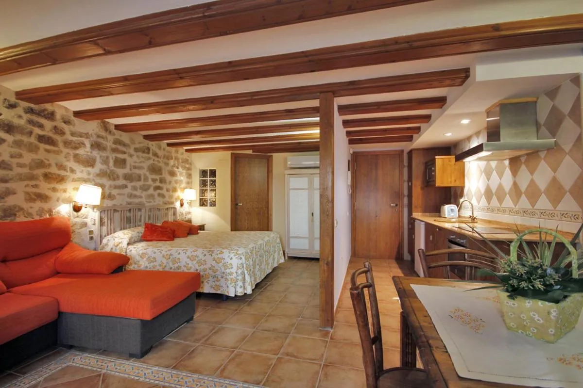 Kitchen or kitchenette, Bed in Apartamentos Santa Agueda