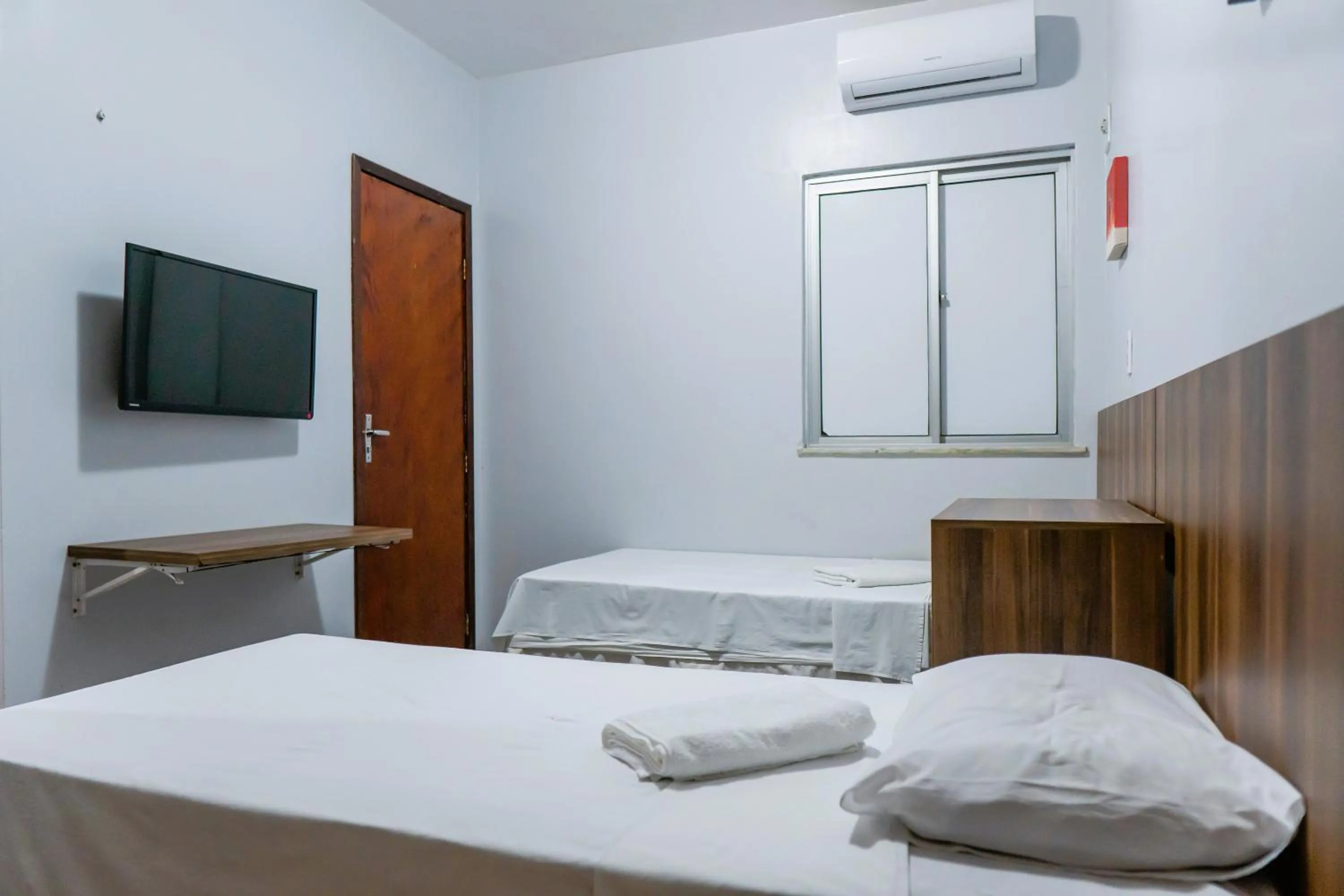 Bed in Pousada das Maracanãs