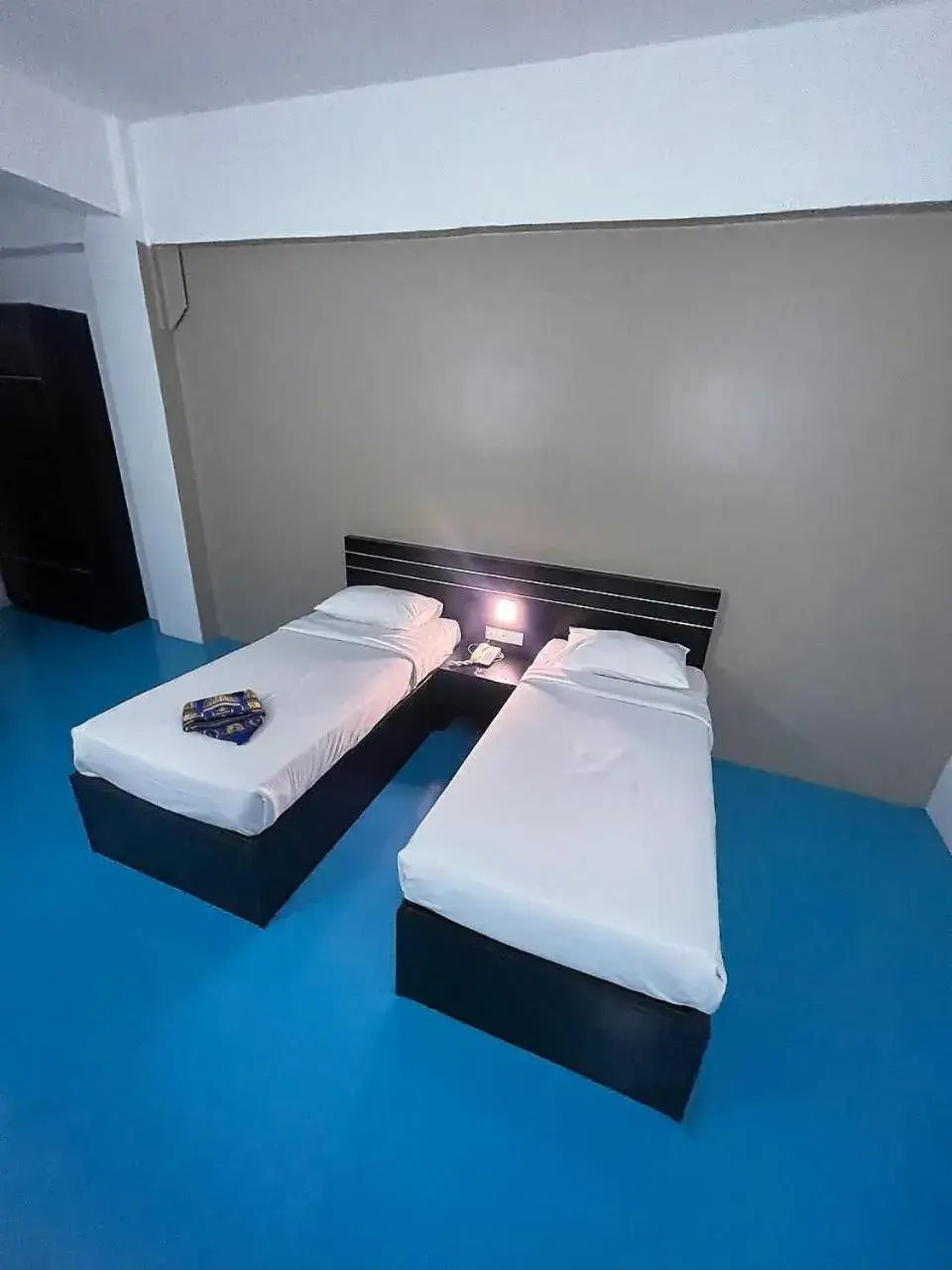 Bed in Kuala Melaka Inn Bed in Kuala Melaka Inn