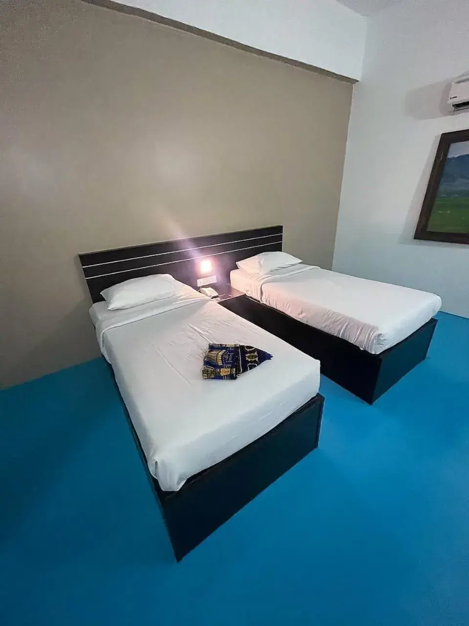 Bed in Kuala Melaka Inn Bed in Kuala Melaka Inn