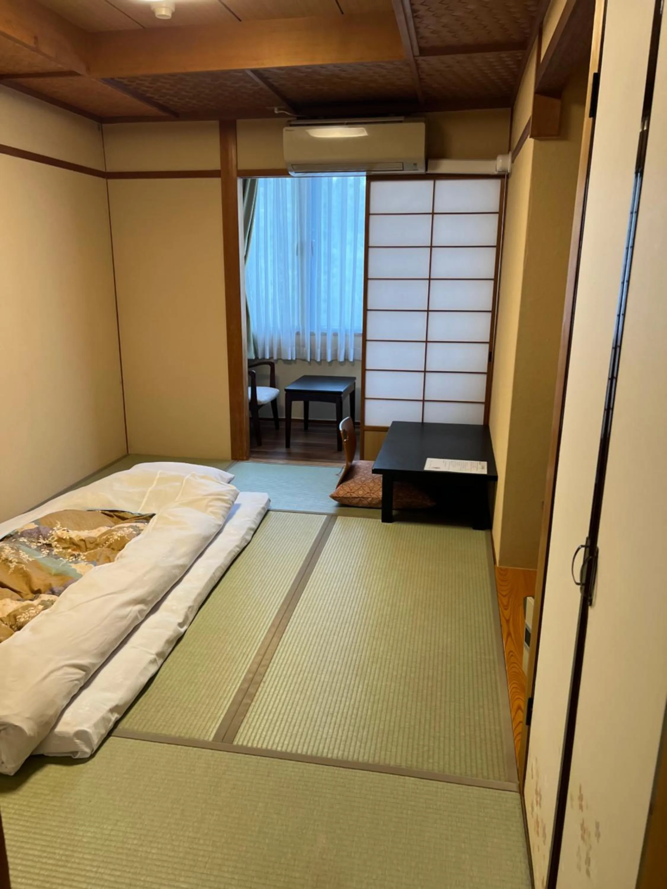 Bed in Ryokan Kousen Kazeya Group