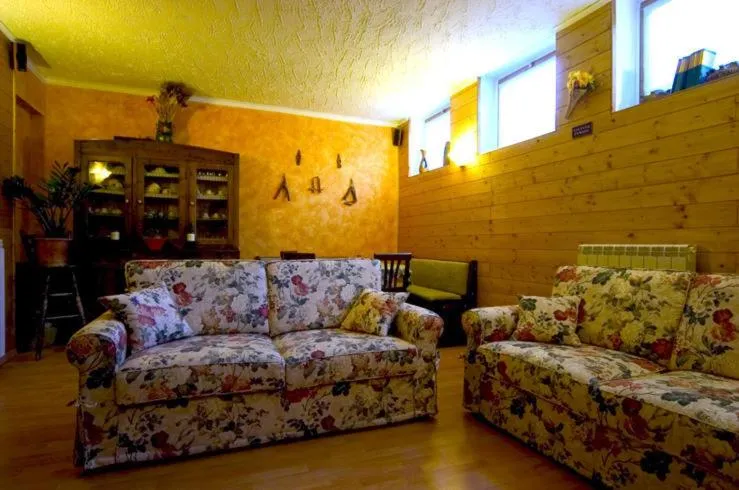 Communal lounge/ TV room in Hotel La Pigna