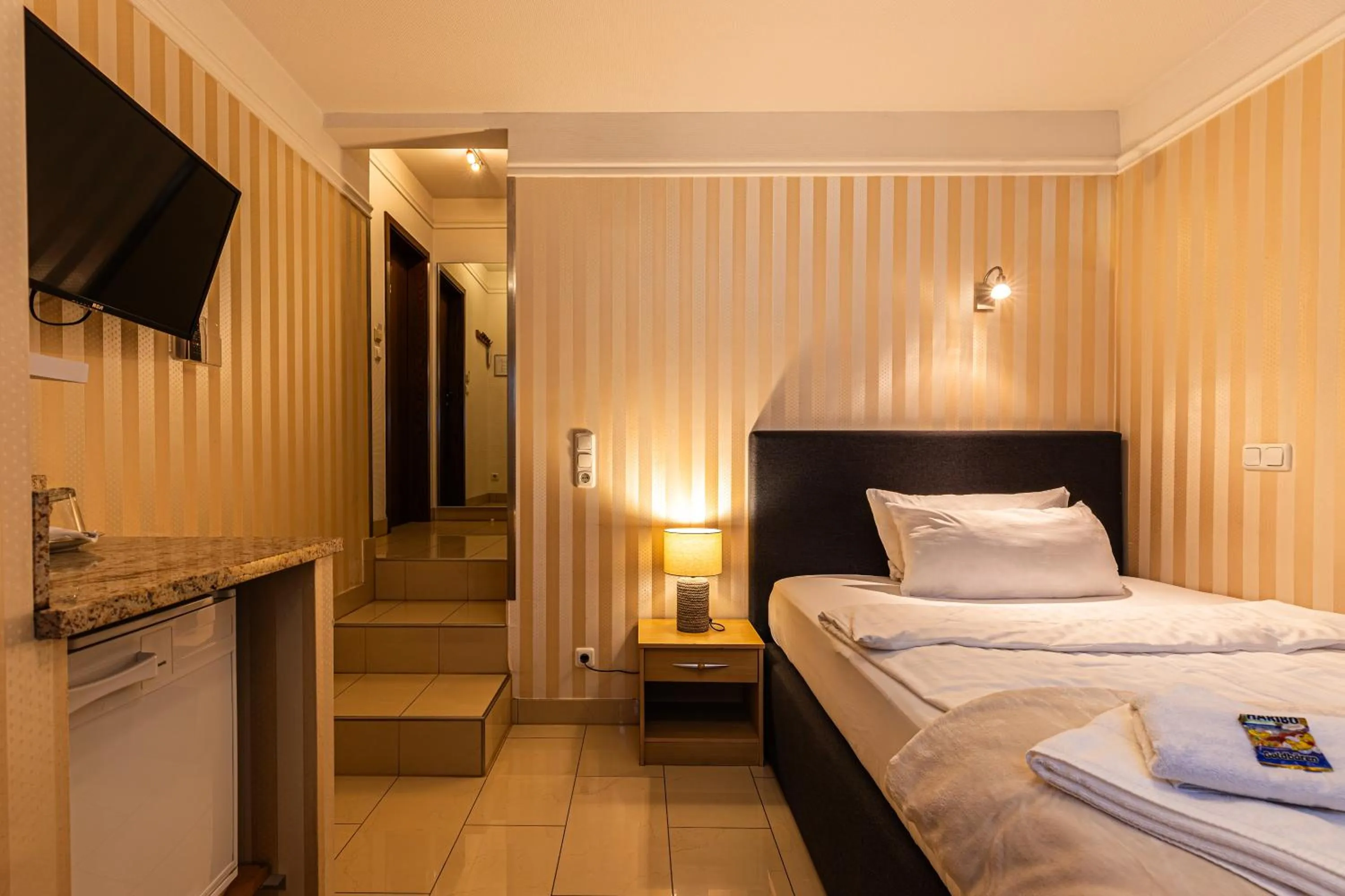 Bed in Gasper Business & Garden Hotel