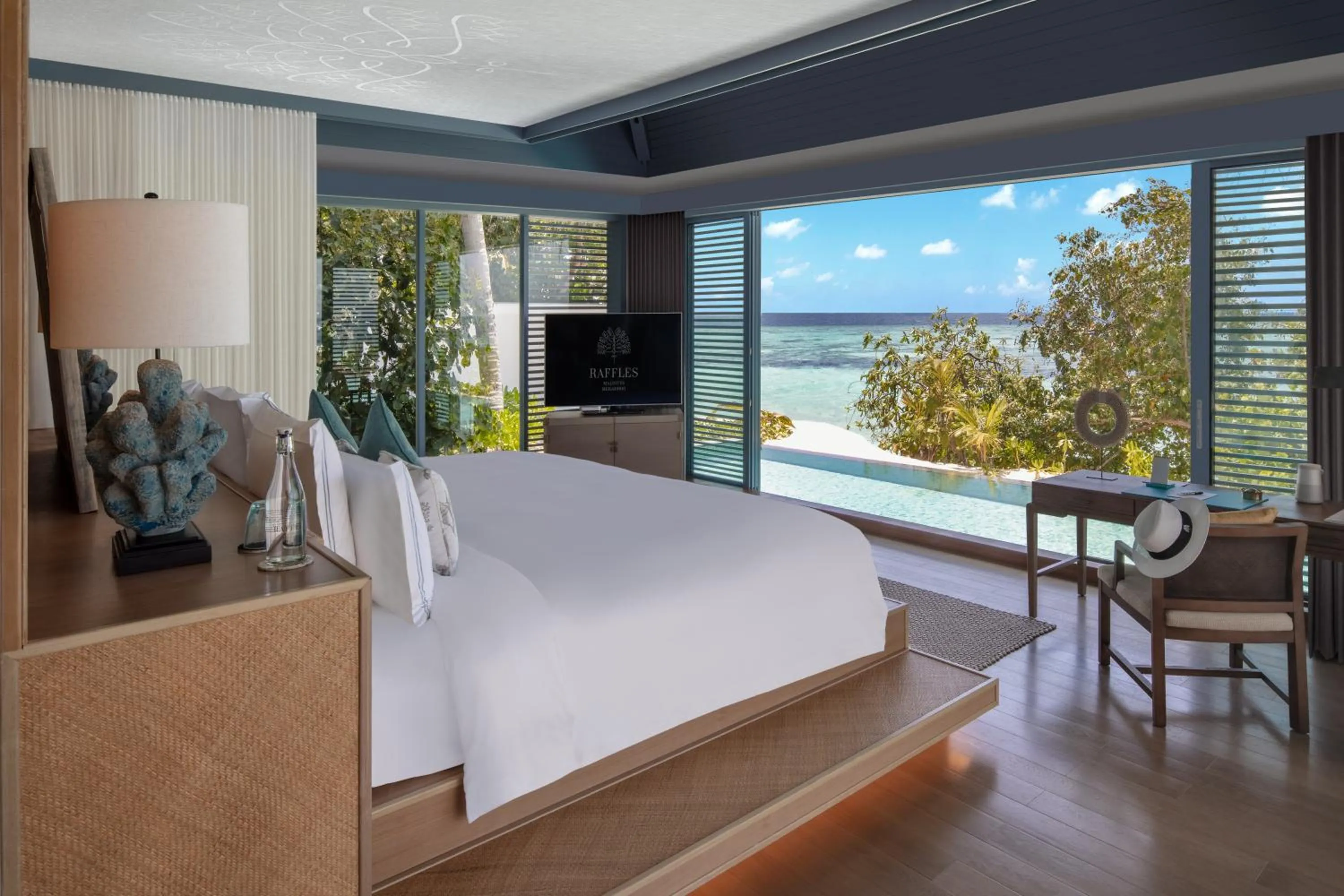 Bed in Raffles Maldives Meradhoo
