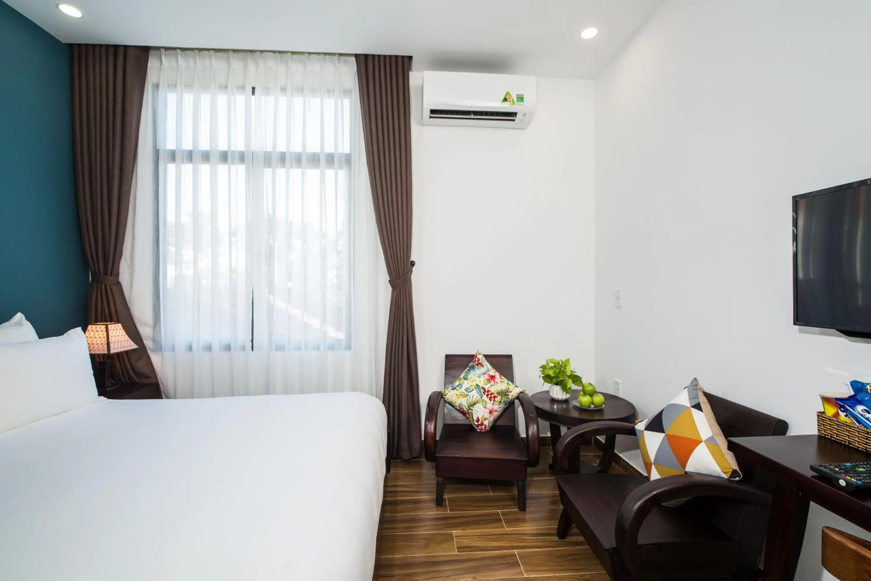 Seating area, Bed in La An Homestay