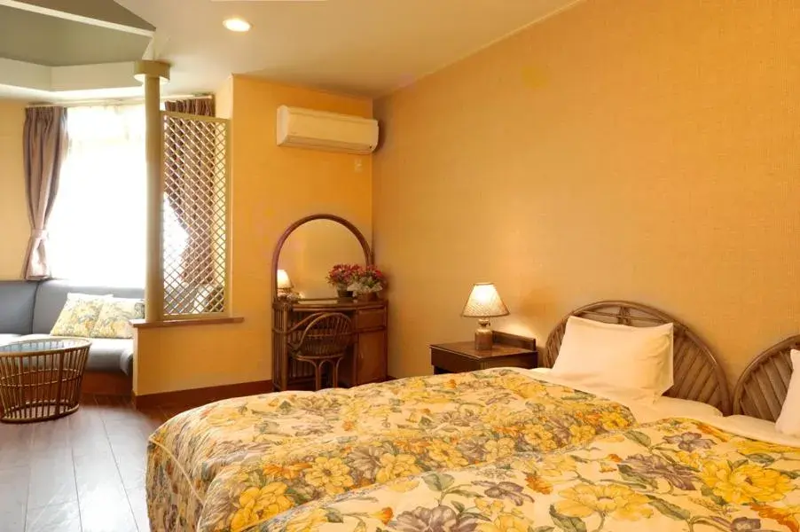 Bed in Petit Resort Hotel Alcyon Bed in Petit Resort Hotel Alcyon