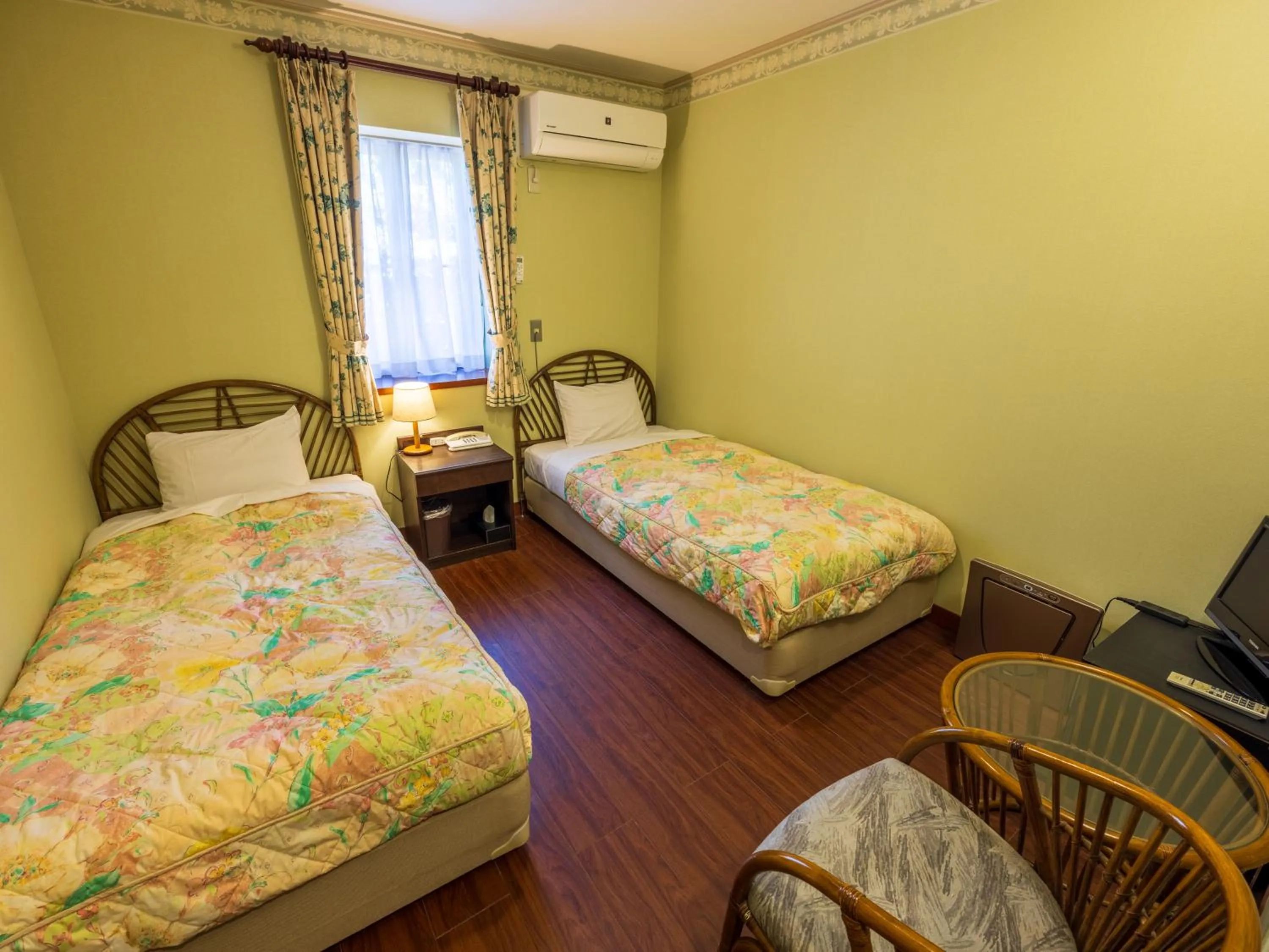 Bed in Petit Resort Hotel Alcyon