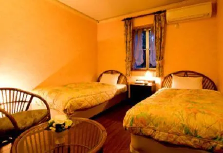 Photo of the whole room, Bed in Petit Resort Hotel Alcyon