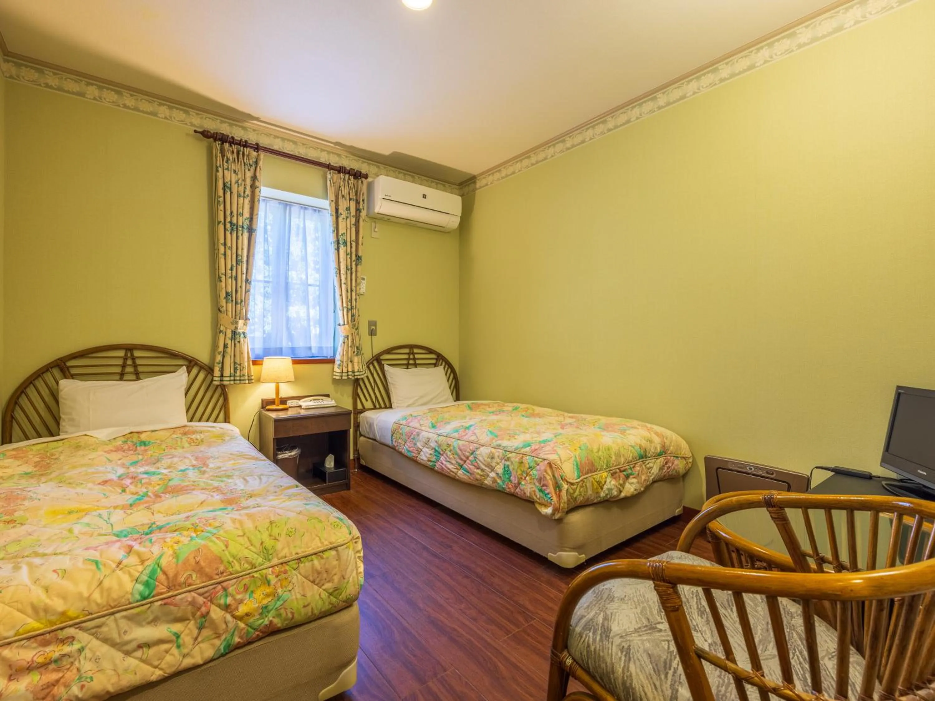 Bed in Petit Resort Hotel Alcyon