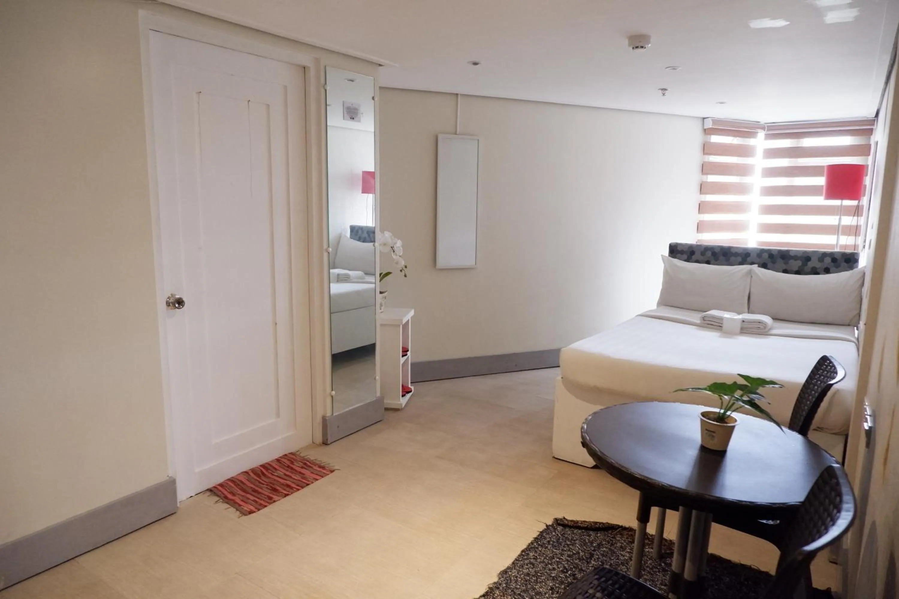 Bed in Sunset View Ridge Residences