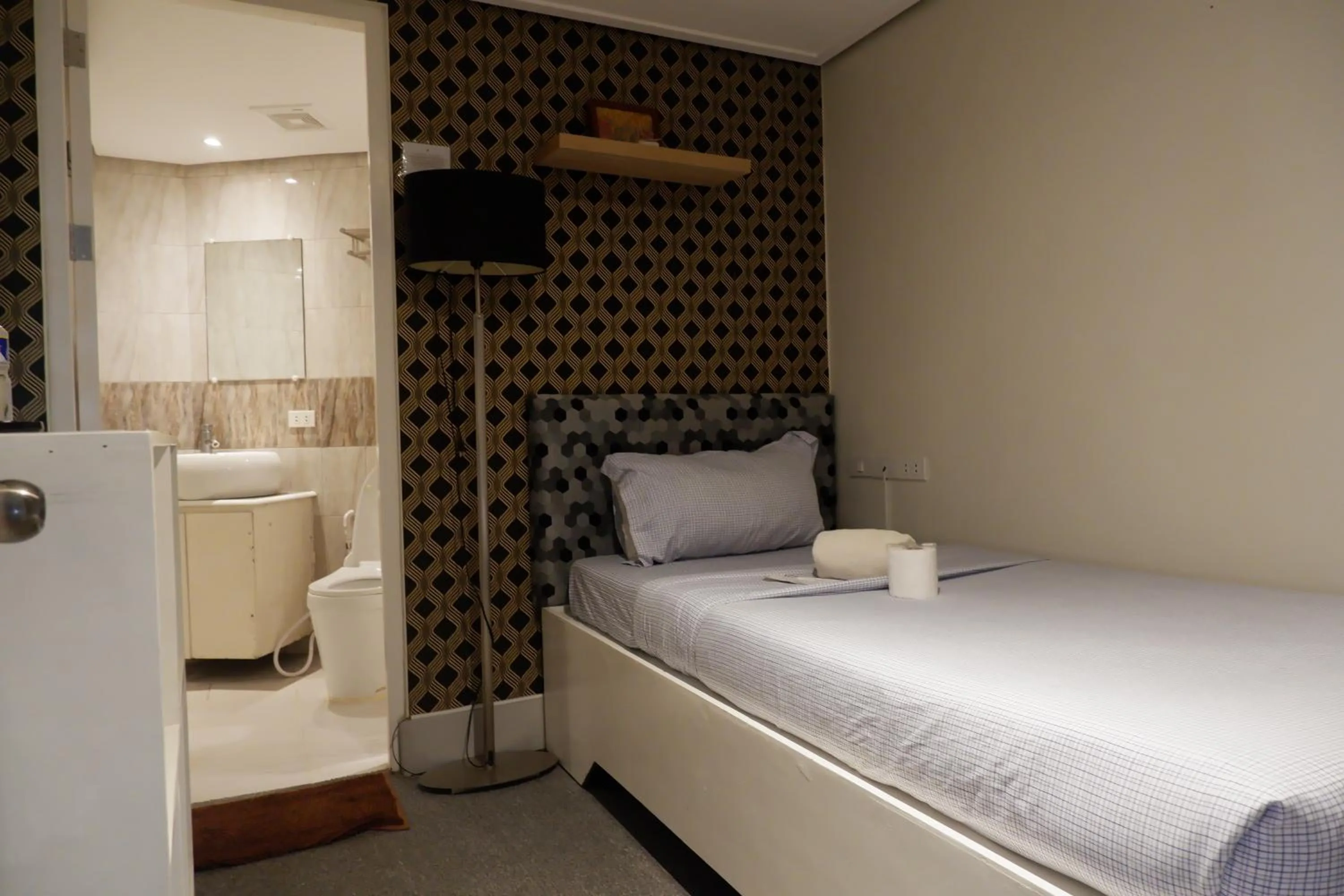 Bed in Sunset View Ridge Residences