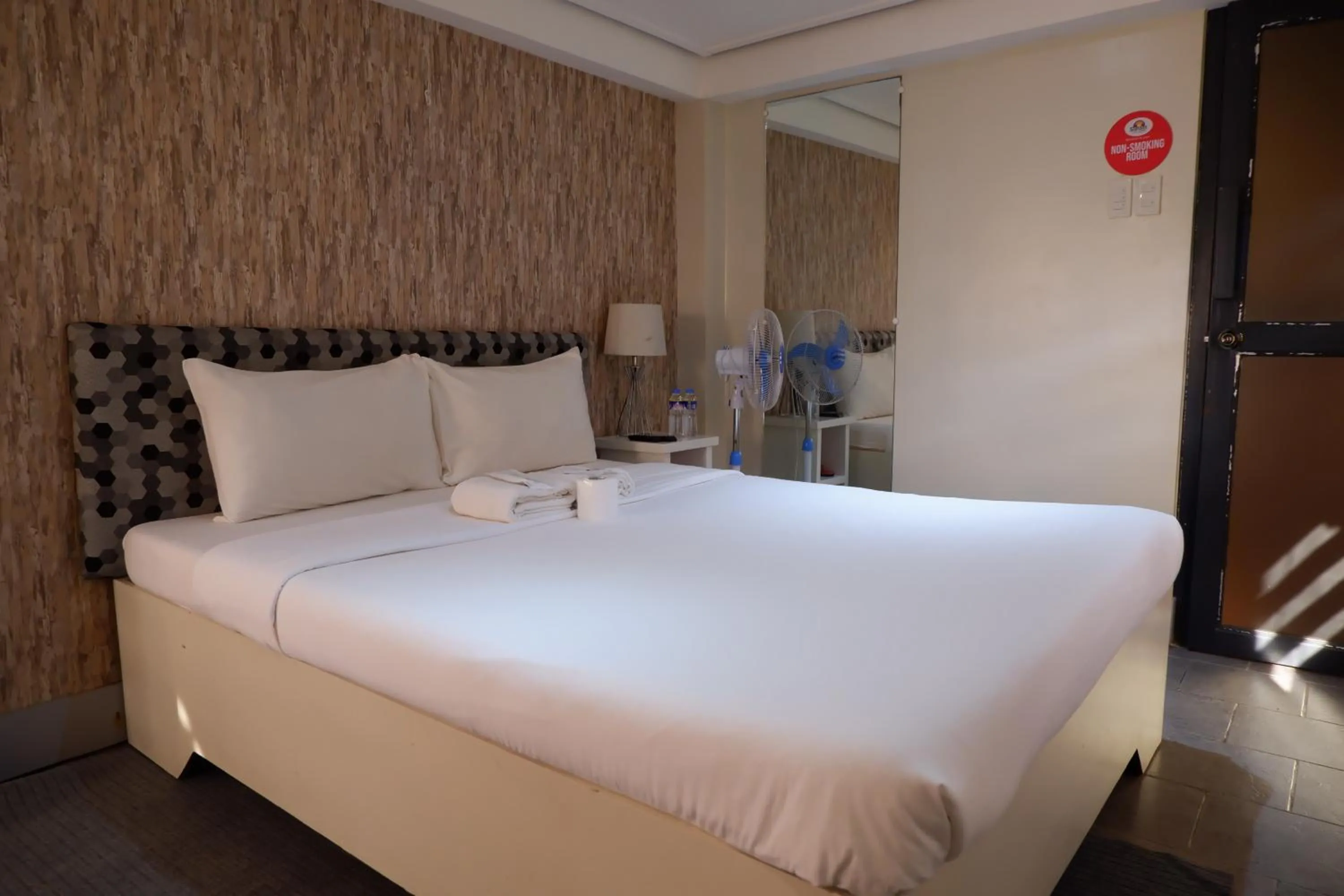 Bed in Sunset View Ridge Residences