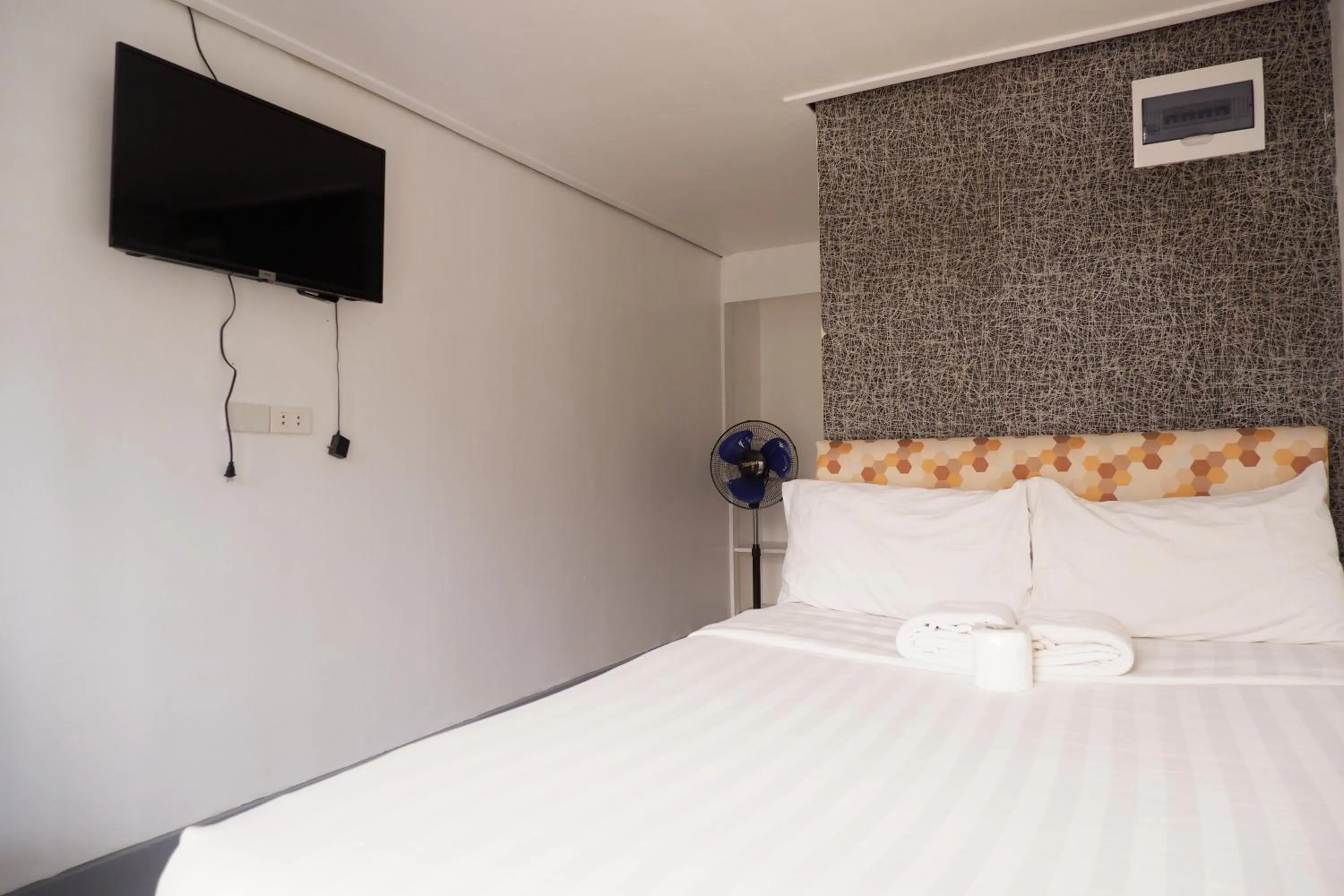 Bed in Sunset View Ridge Residences