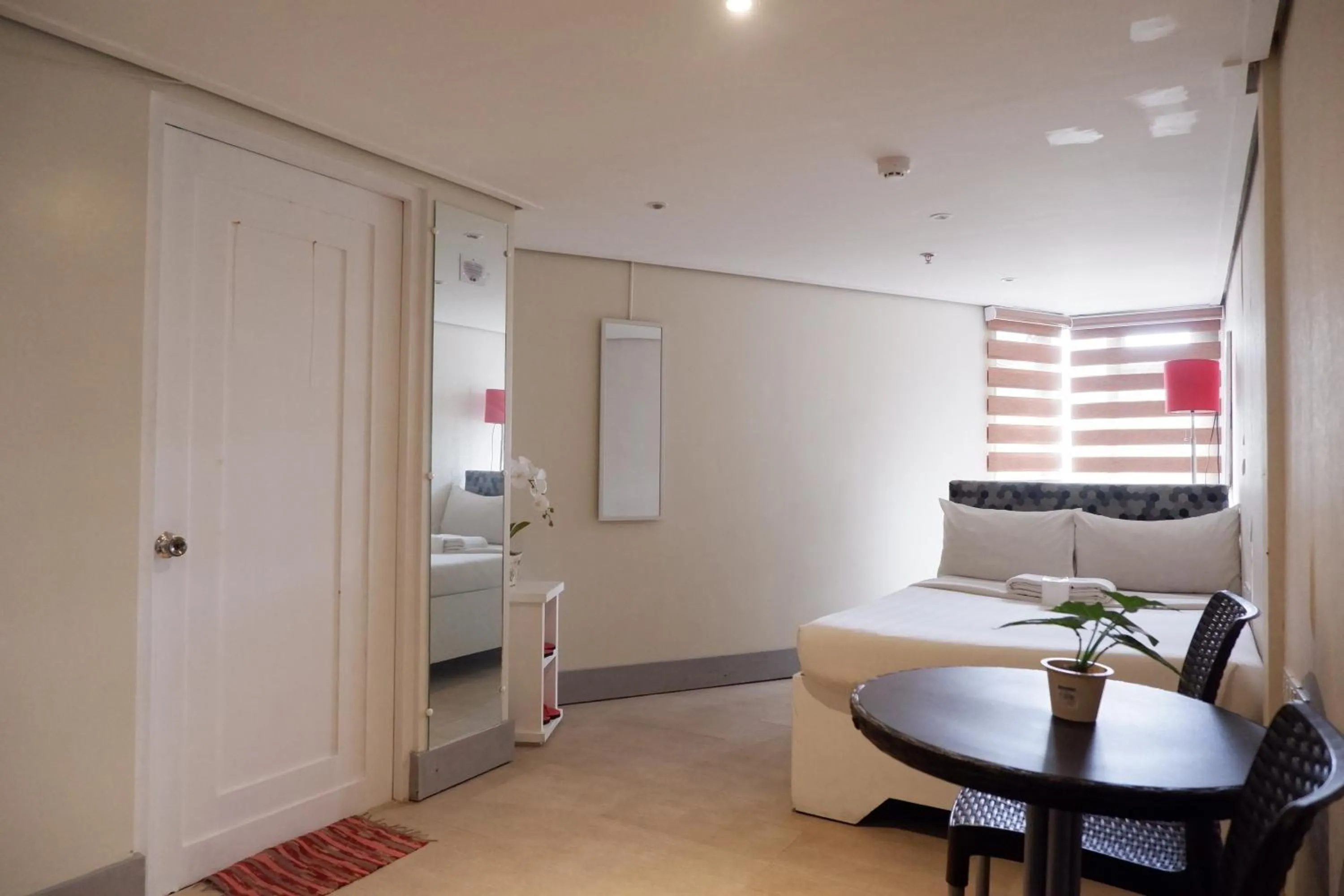 Bed in Sunset View Ridge Residences