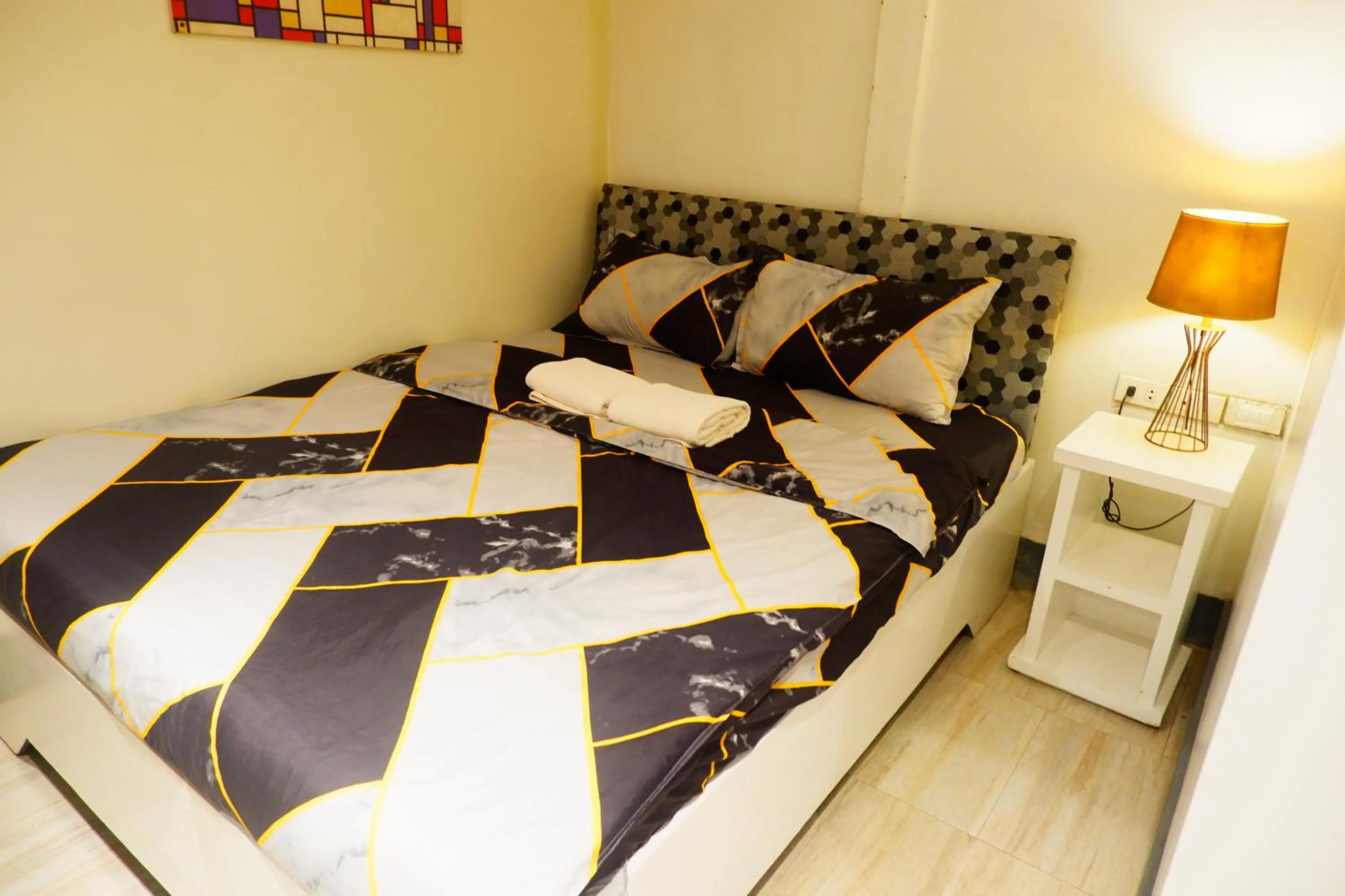 Bed in Sunset View Ridge Residences