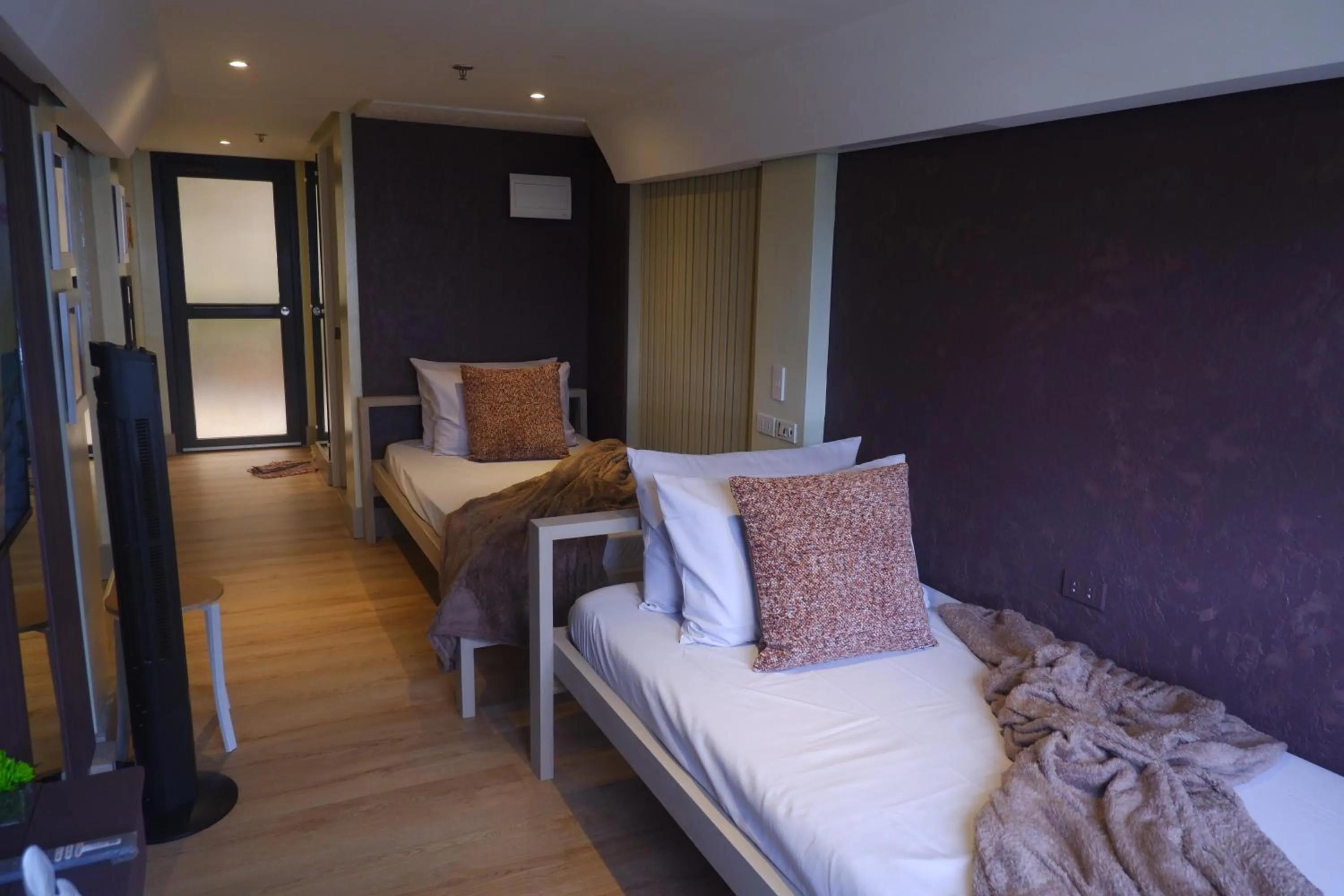 Bed in Sunset View Ridge Residences