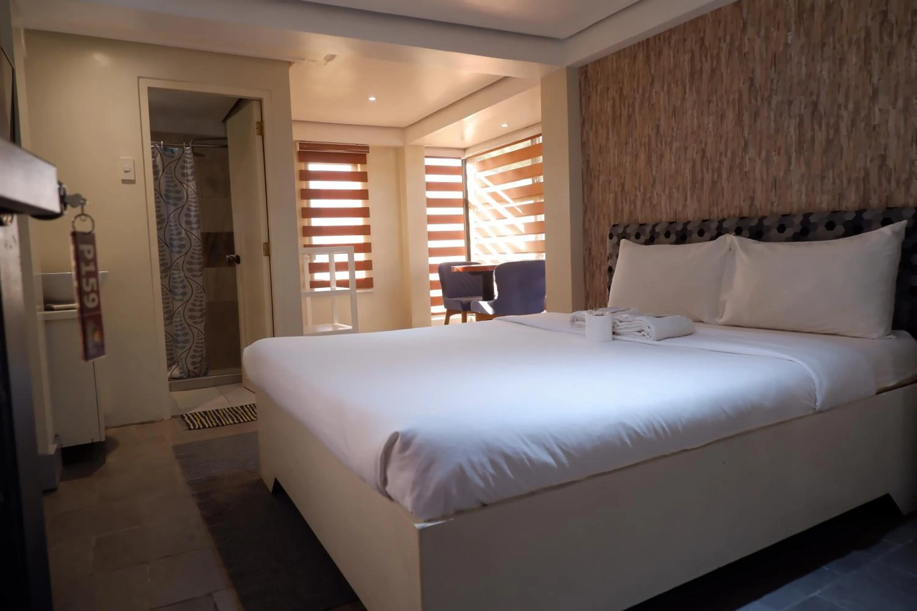 Bed in Sunset View Ridge Residences