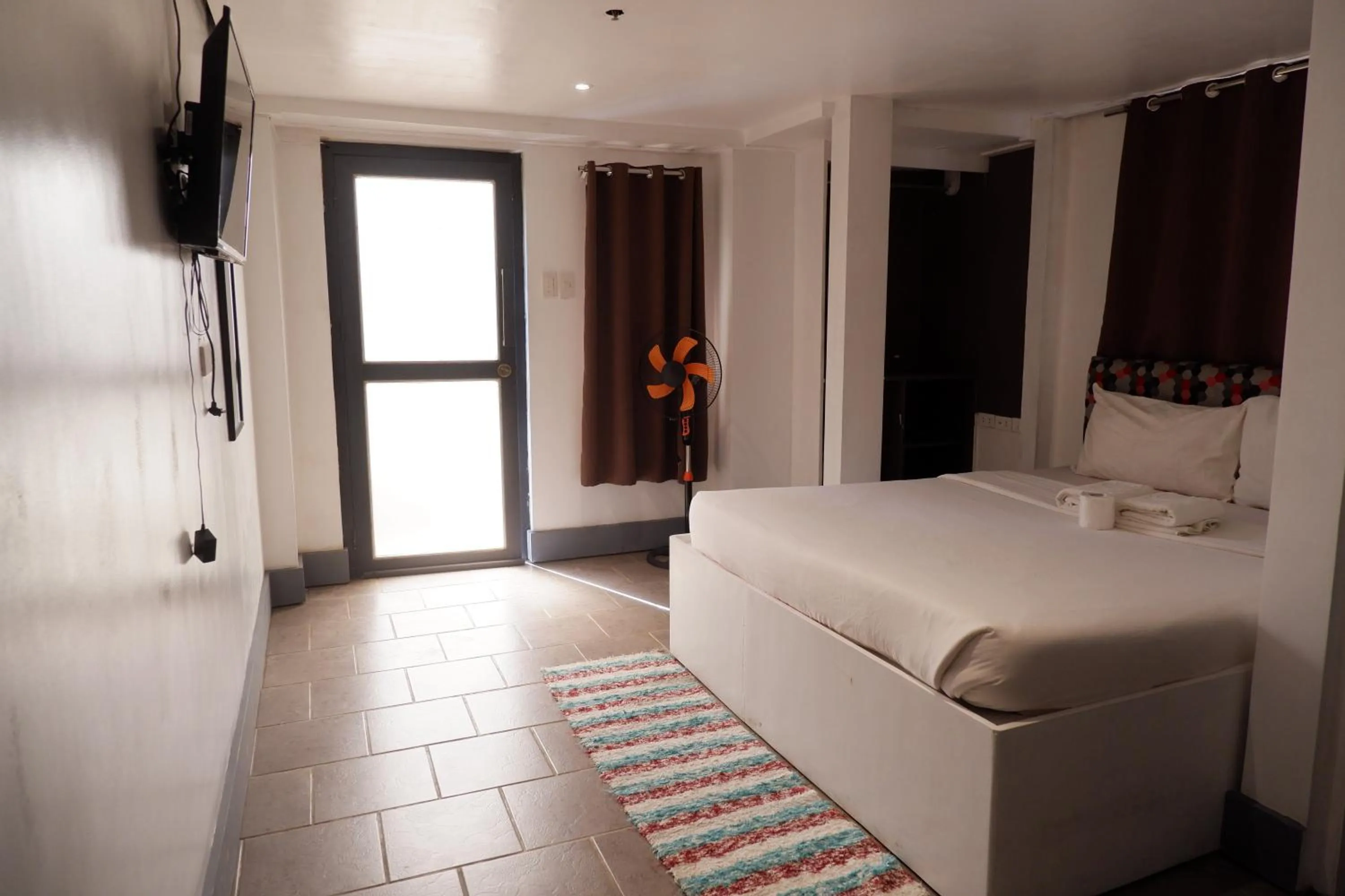 Bed in Sunset View Ridge Residences