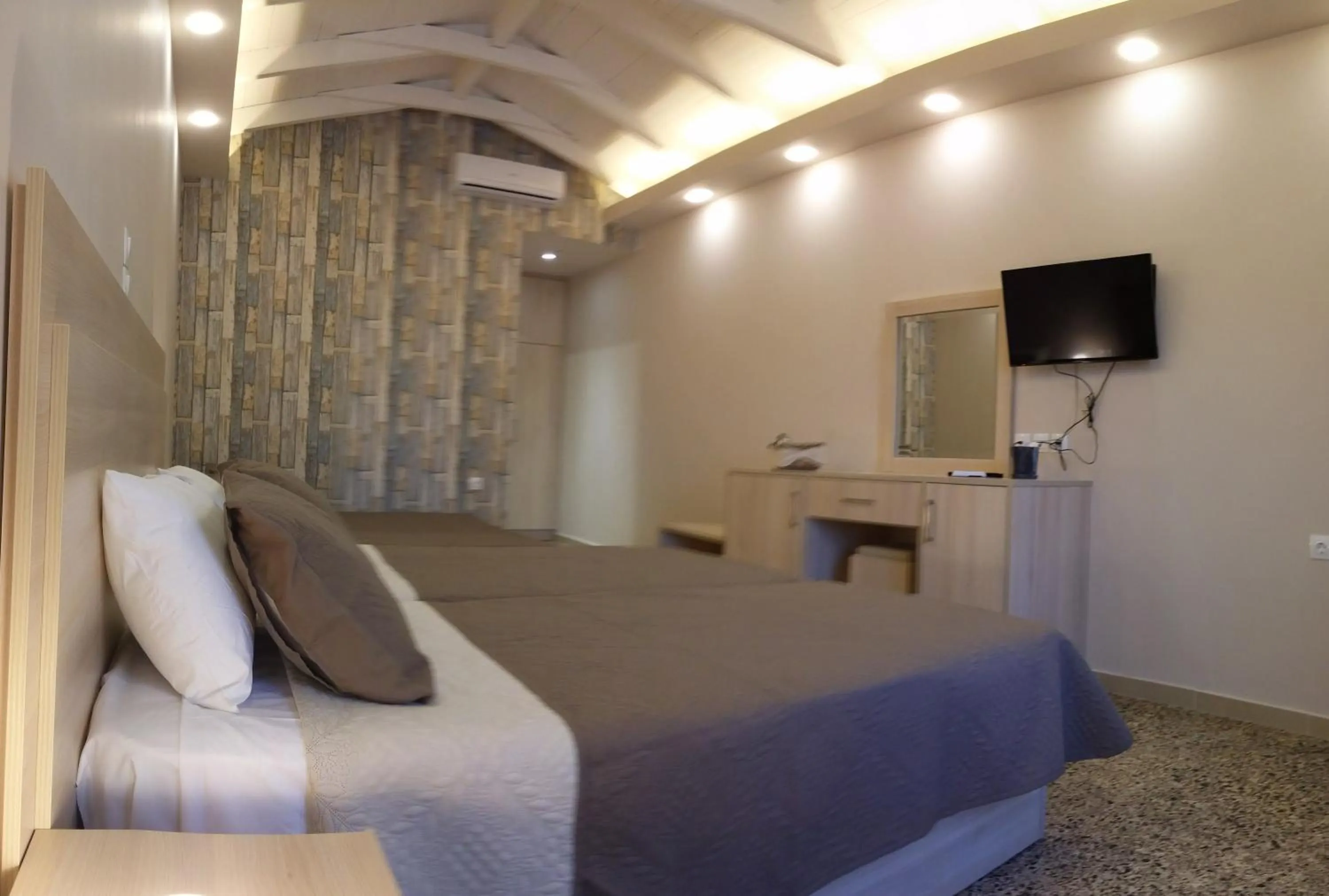 Bed in Anetis Beach Hotel