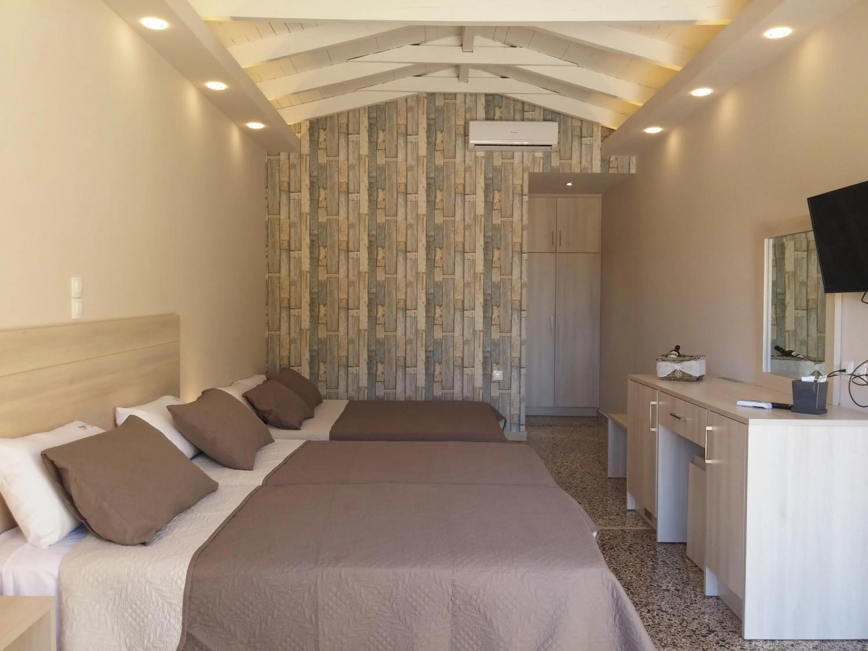 Bed in Anetis Beach Hotel