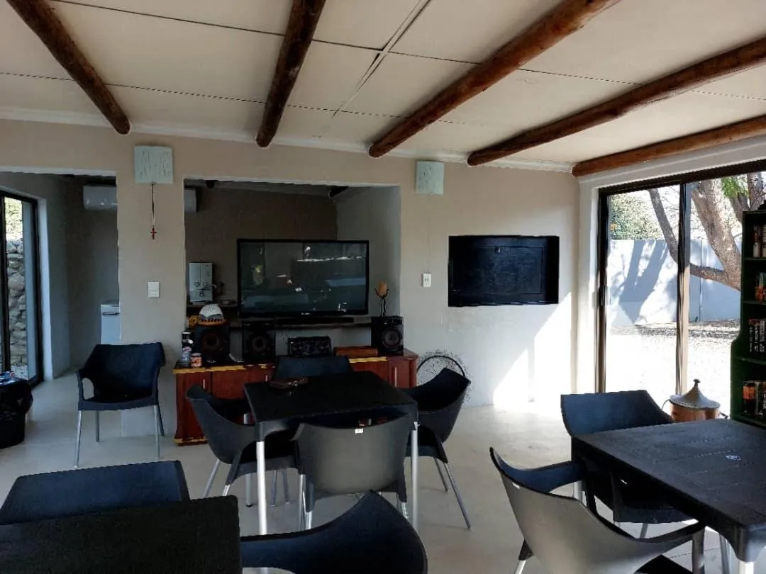 Communal lounge/ TV room in Bush Pillow Guest House