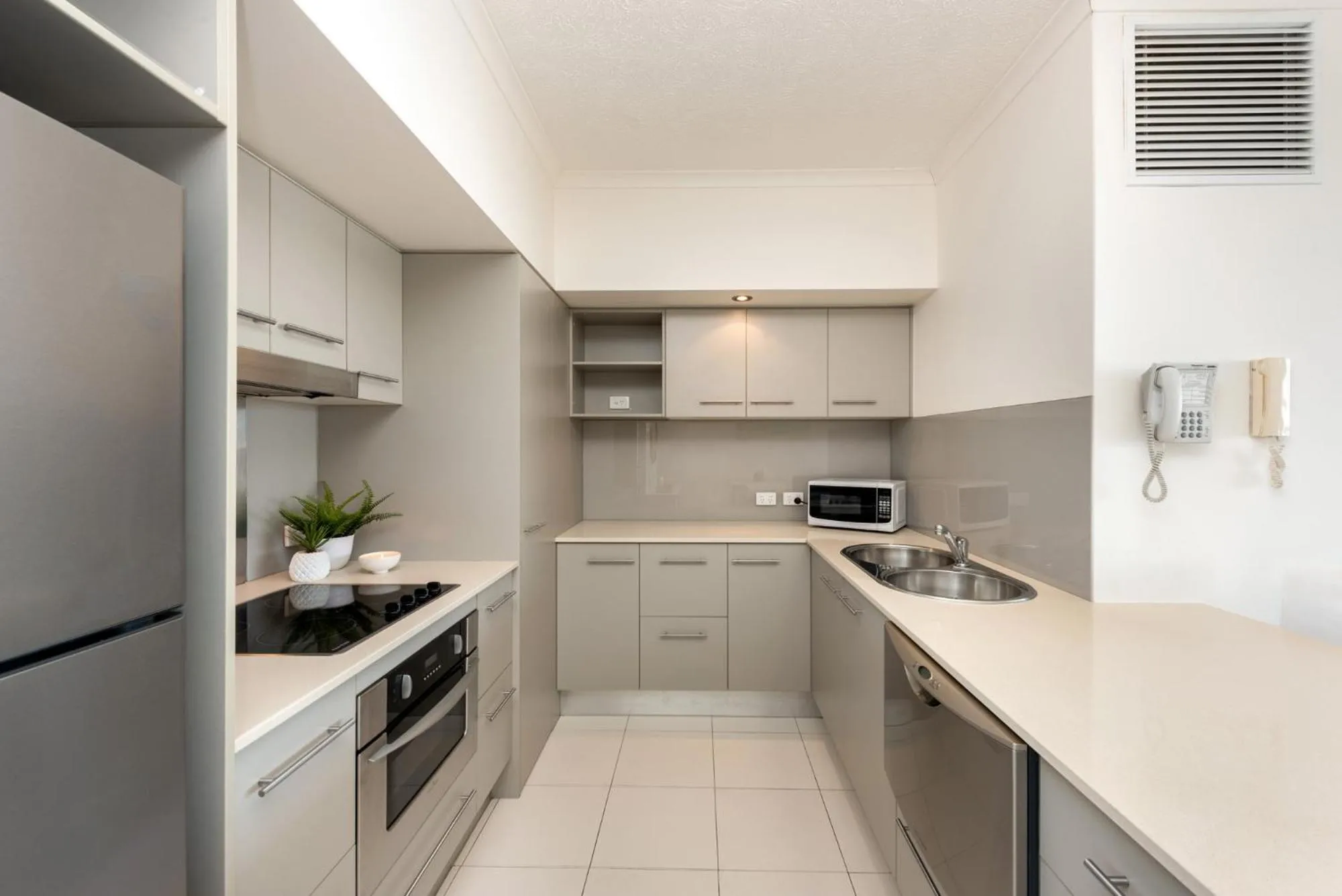 Kitchen or kitchenette in On The Beach Resort Bribie Island