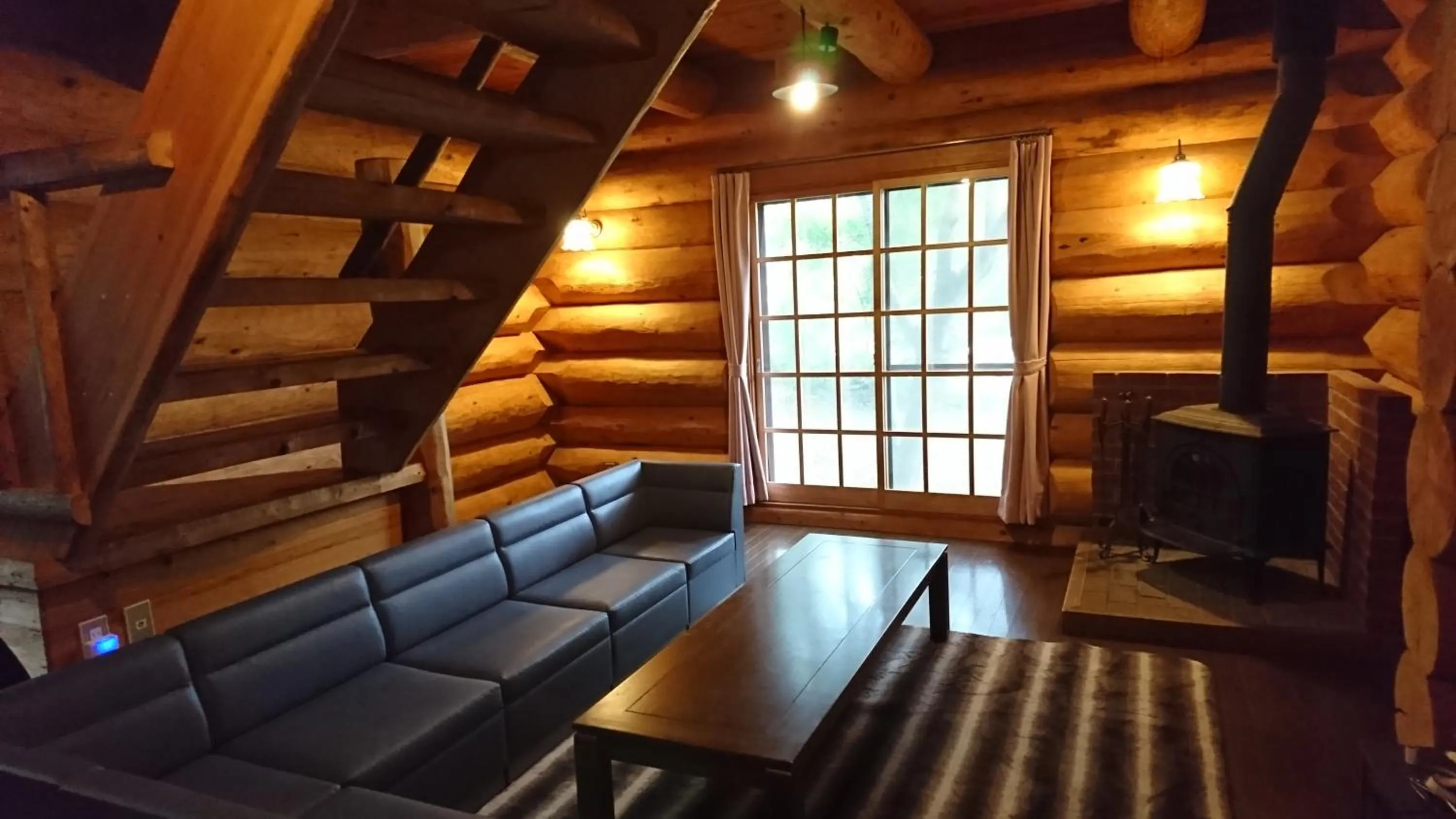 Living room in White Tree Log House Madarao Tangram