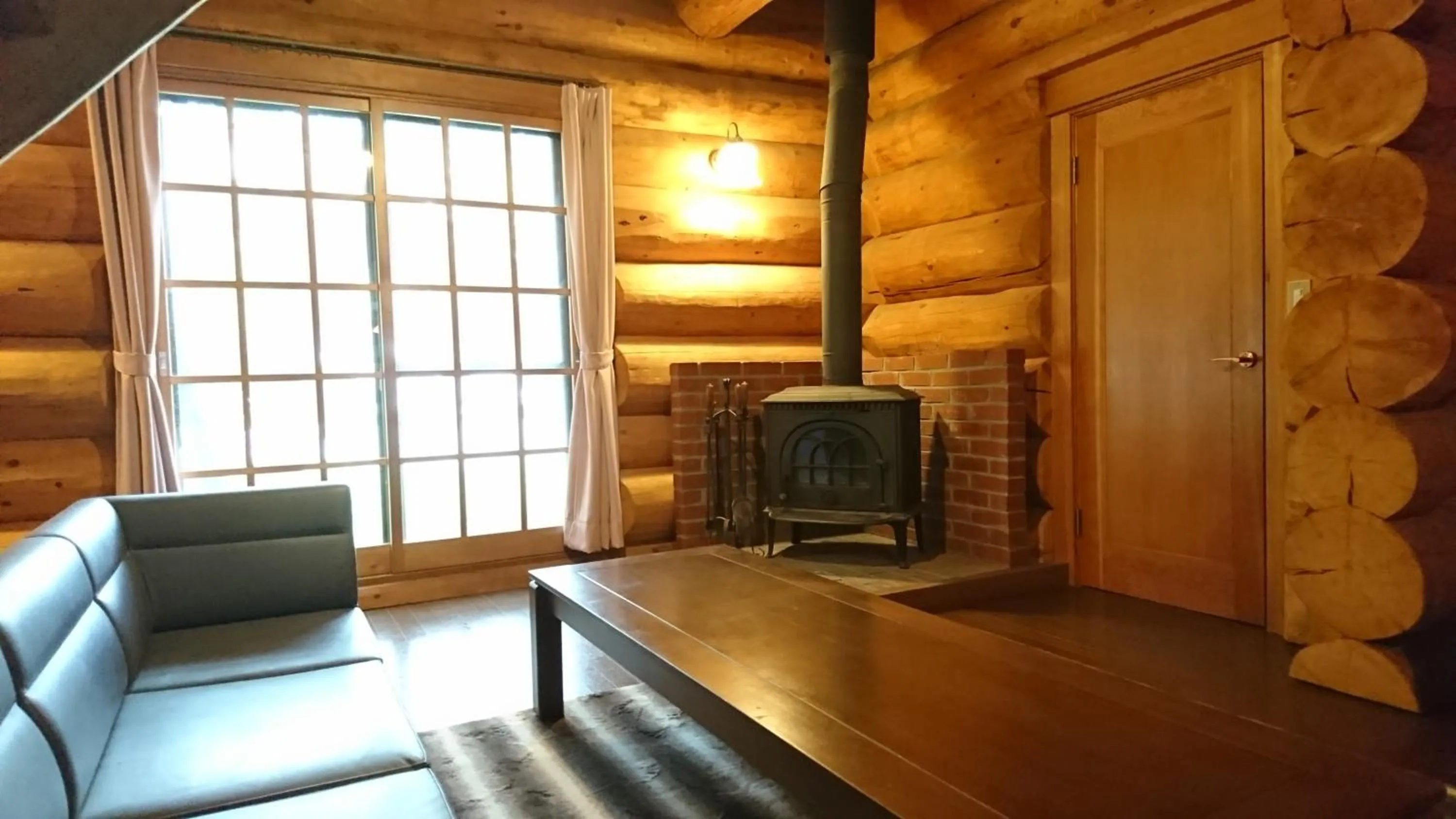 Living room in White Tree Log House Madarao Tangram