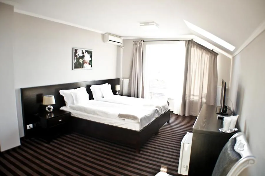 Bed in Pensiunea Belanco