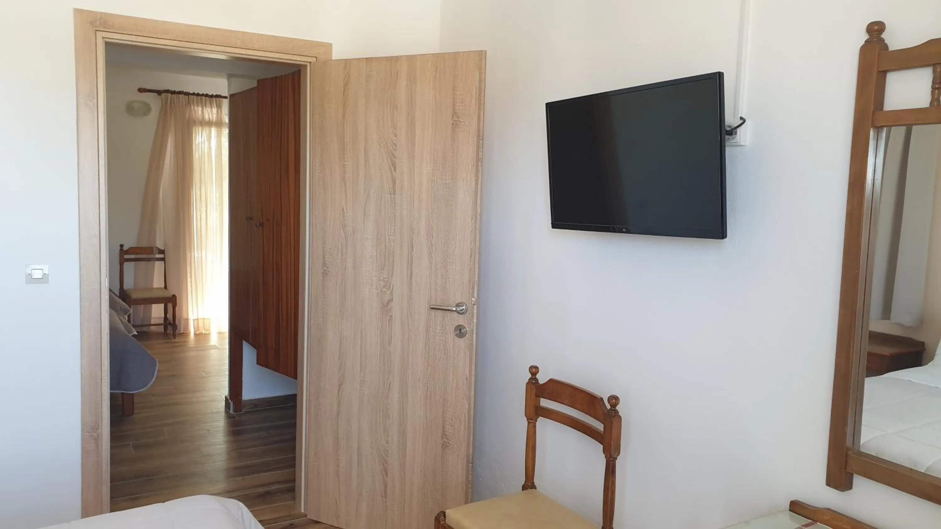 TV and multimedia, Bed in Miros Hotel Apartments