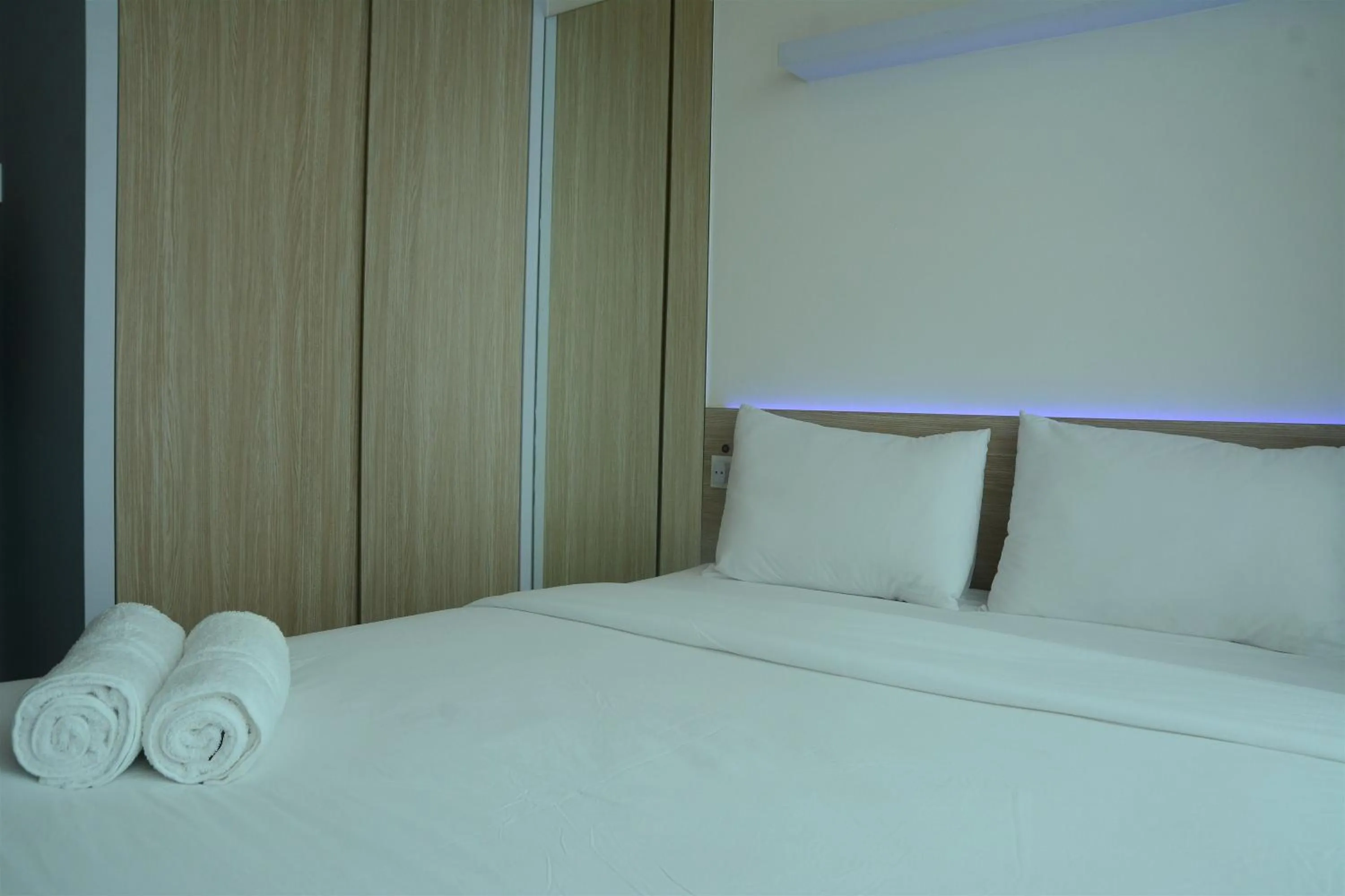 Bed in Brand New Studio Tree Park City BSD Apartment near ICE BSD By Travelio
